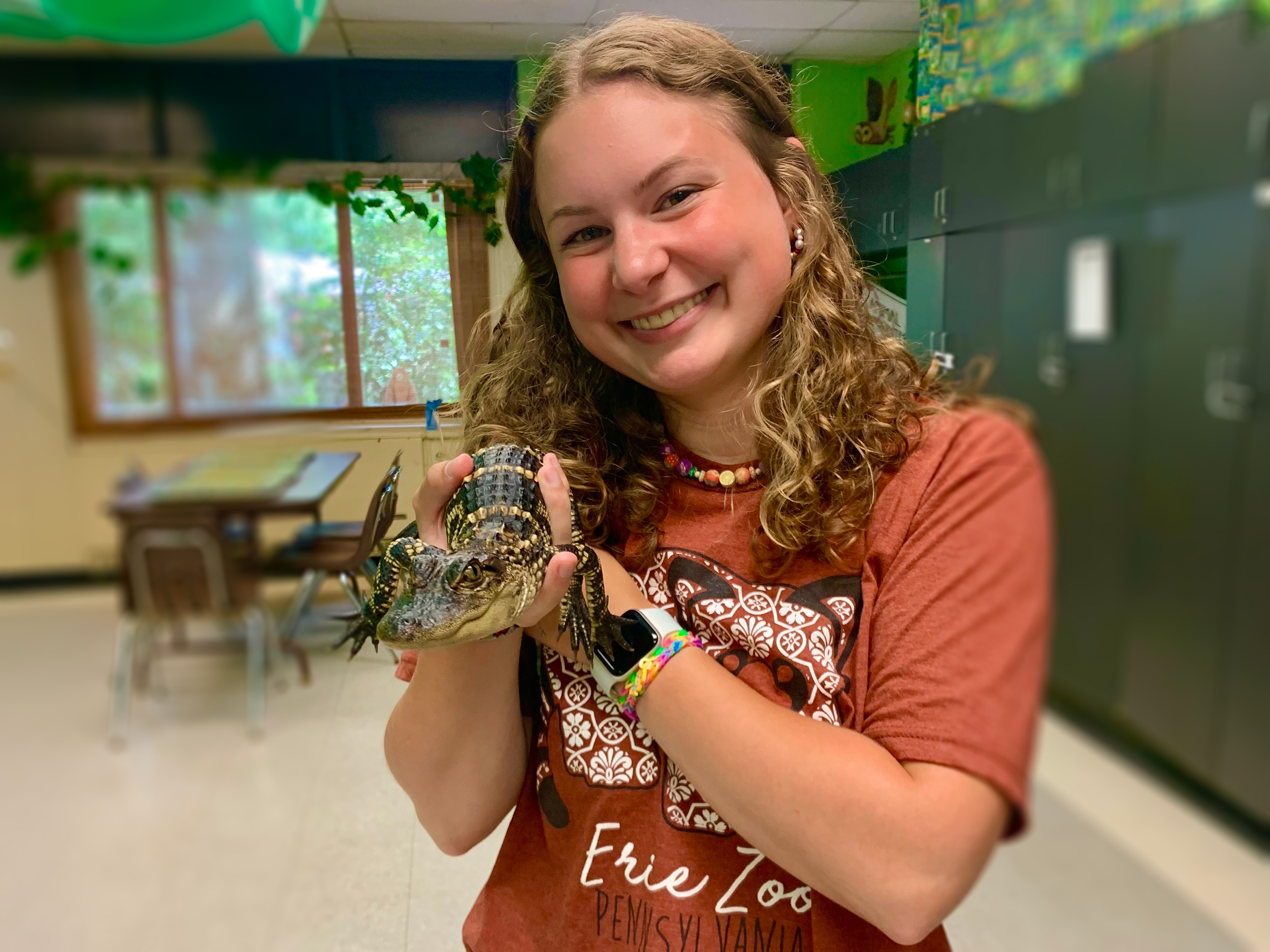 Penn State student Sarah Zurn holding an alligator