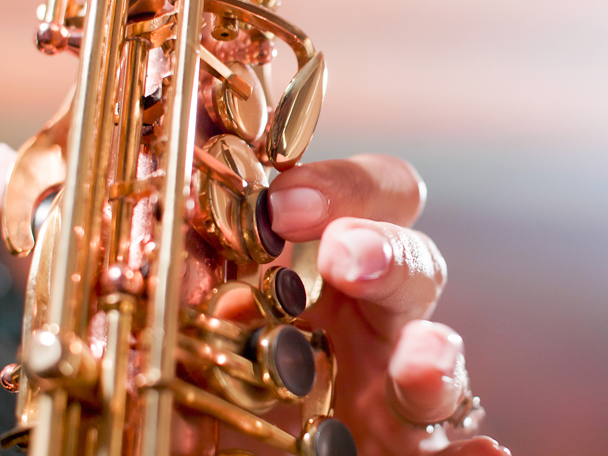 A closeup of someone playing a saxophone