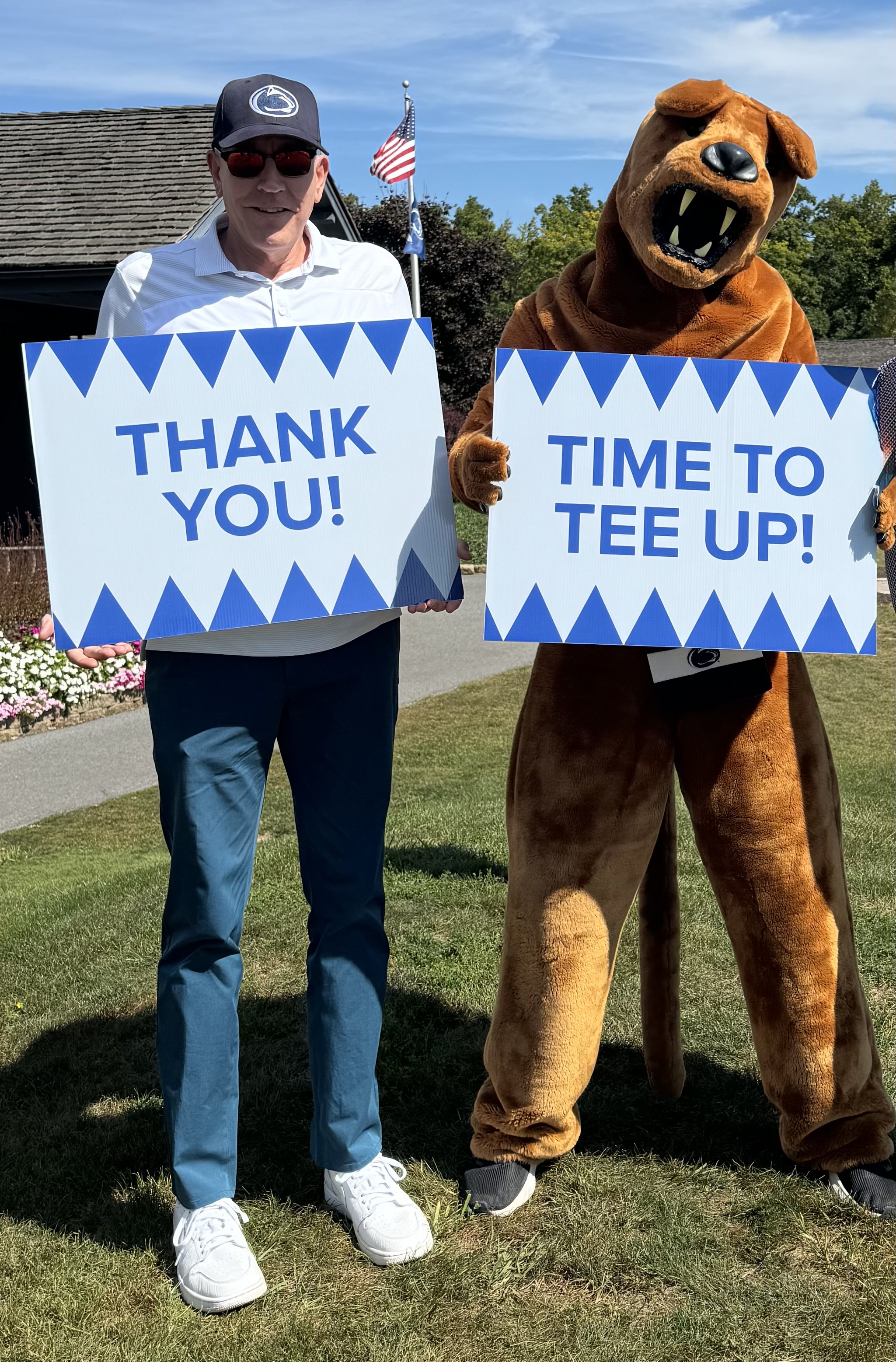 David Horton and the Nittany Lion hold up thank you signs at the 26th annual Penn State IT Golf Tournament.