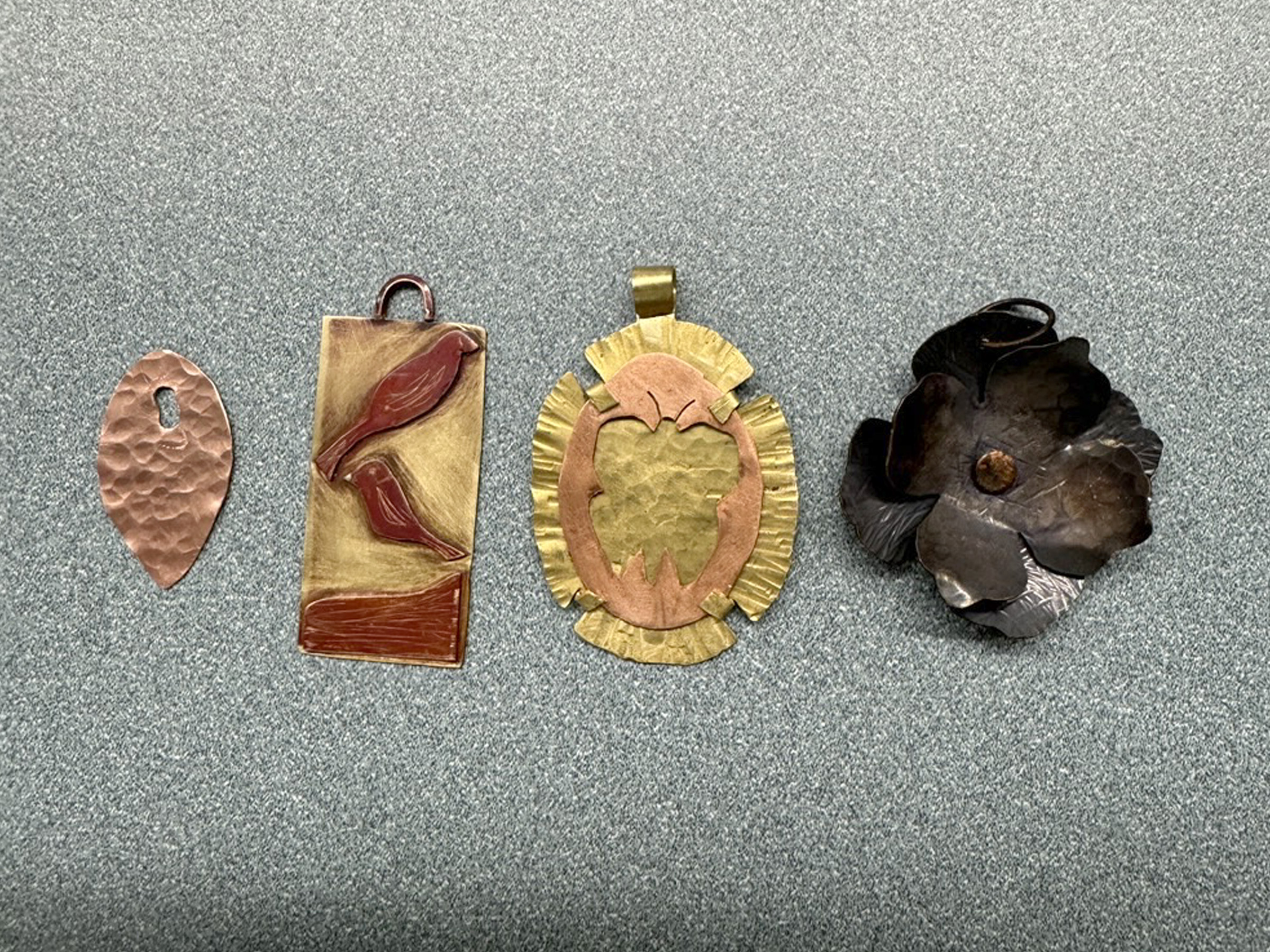 Examples of jewelry made during a previous session of the jewelry making and metalsmithing courses offered through continuing and community education at Penn State DuBois.