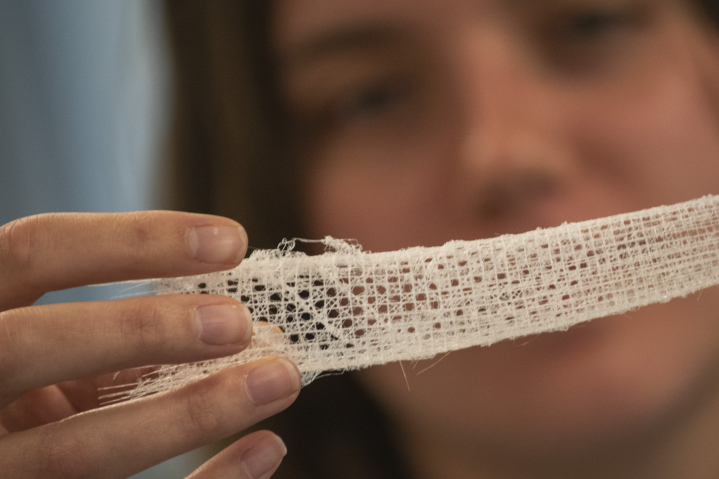 Olivia Lowe examining a sea sponge