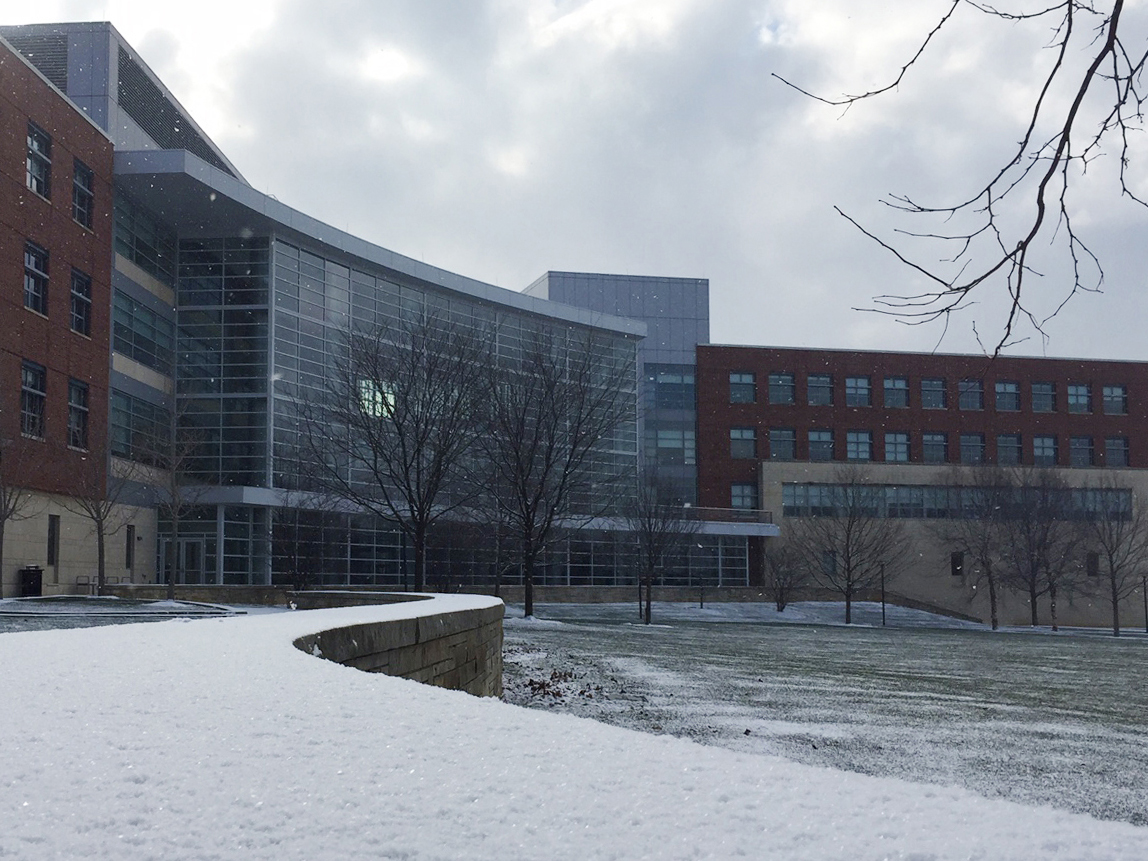 A photo of the business building with snow on the ground.