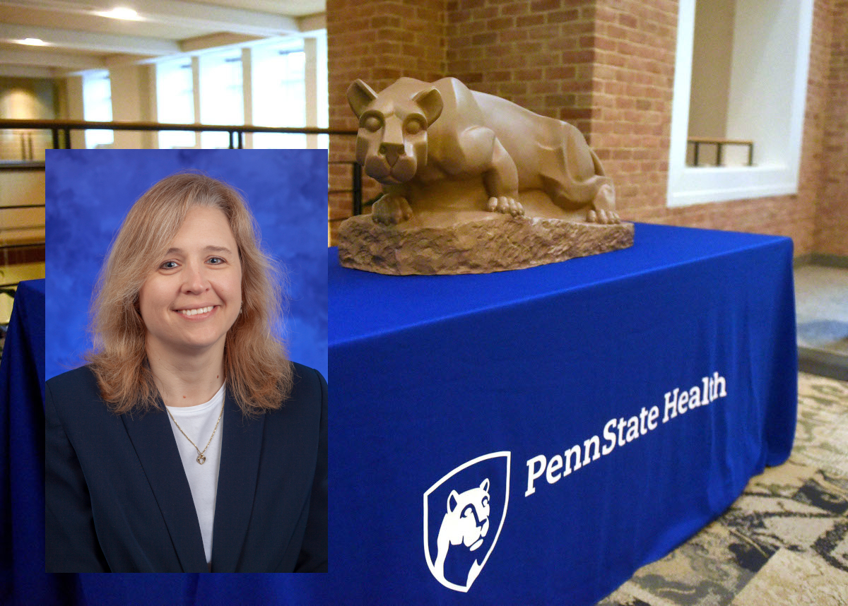 A professional headshot of Paula Tinch, superimposed over a larger photo of a table with a Penn State Nittany Lion statue on it.