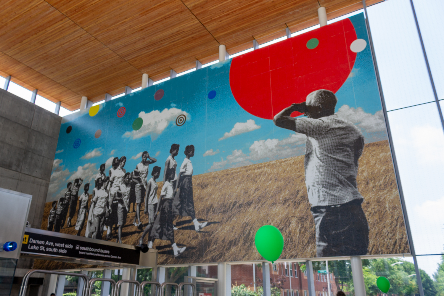 Mural showing young people of color walking across a Midwestern prairie