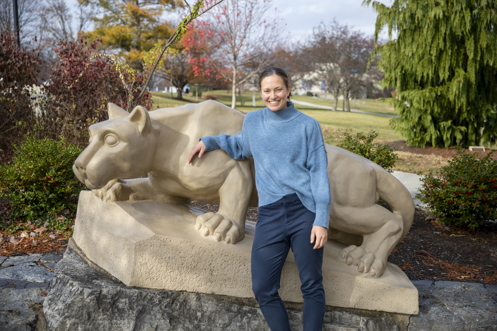 Diana Stoltzfus standing by the lion shrine