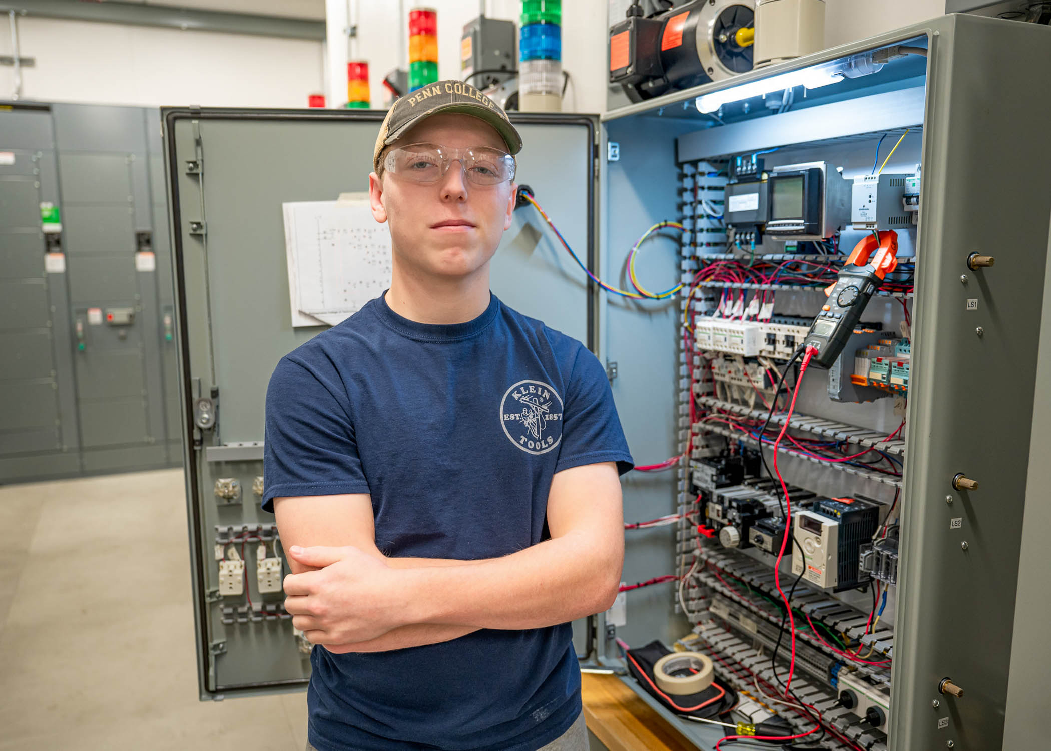 Gage L. Romanoskie standing among equipment