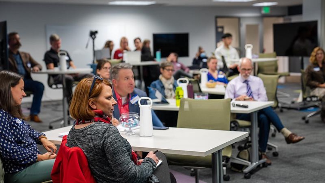 Penn State faculty listening to a presentation on factors that influence student success. 