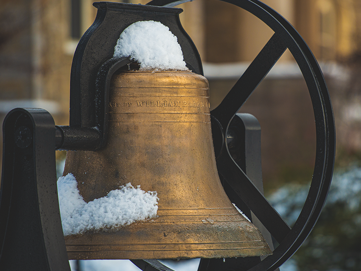 Snow-covered Old Main Bell