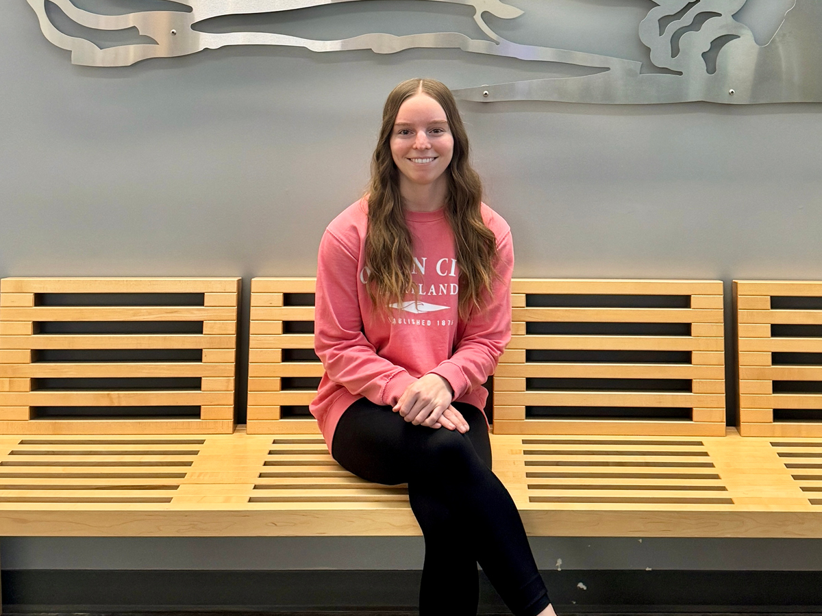 Photo of Sydney Bankert sitting in Gaige Building