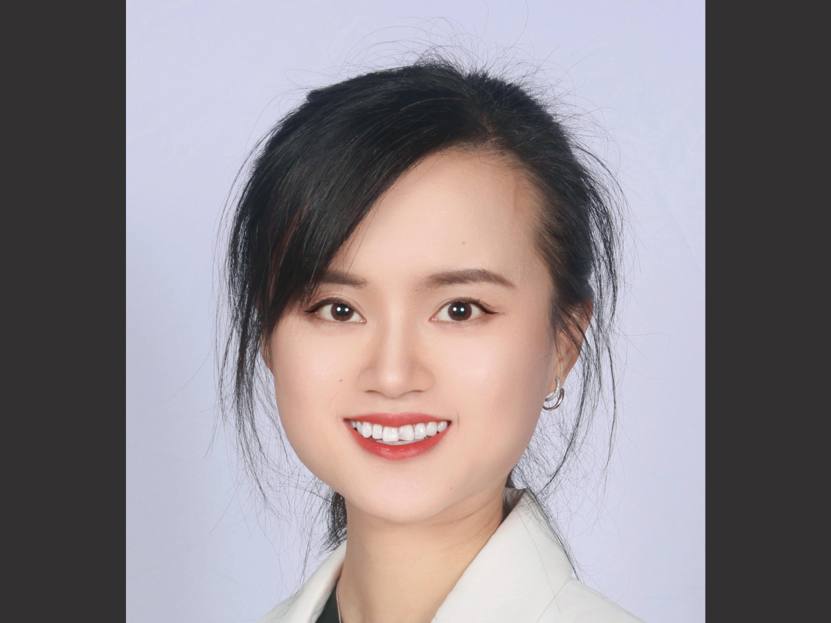 Photo of a smiling woman in a head and shoulders portrait 