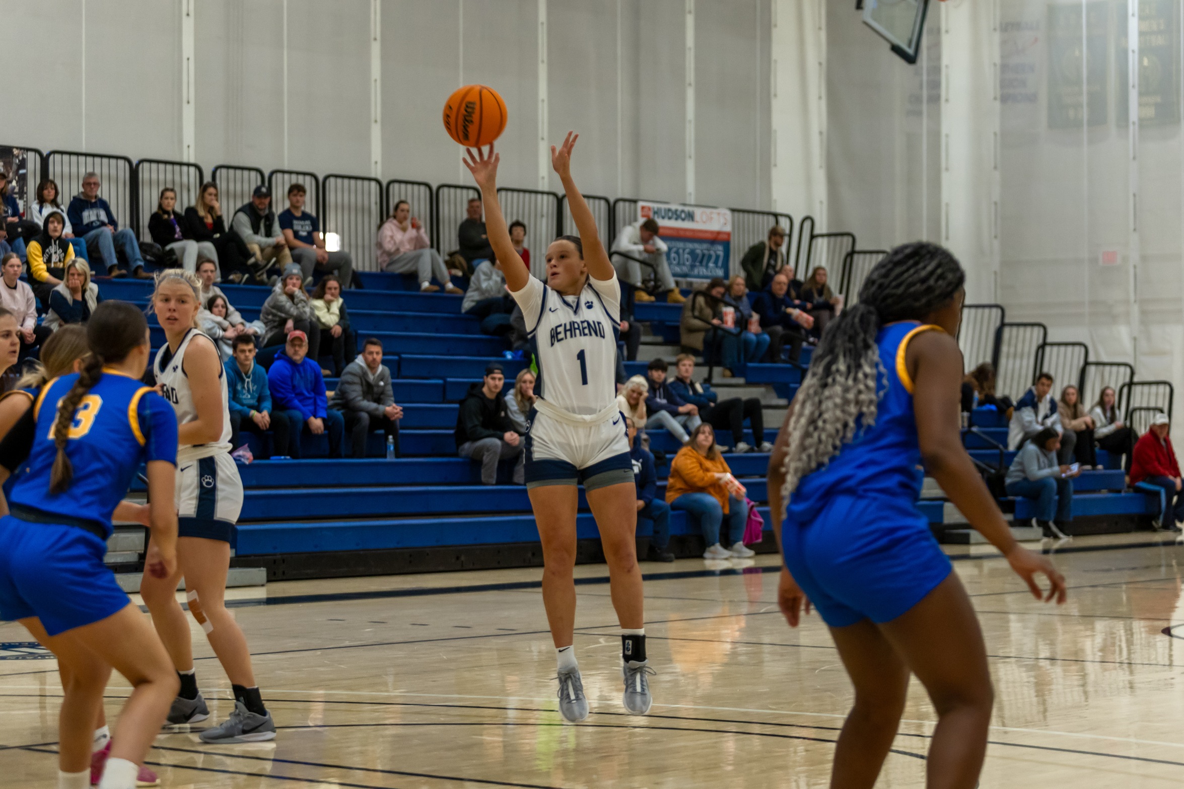 A member of the Penn State Behrend women's basketball team shoots a jump shot.