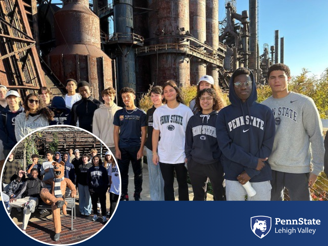 students wearing Penn State shirts smile while standing in front of Bethlehem SteelStacks