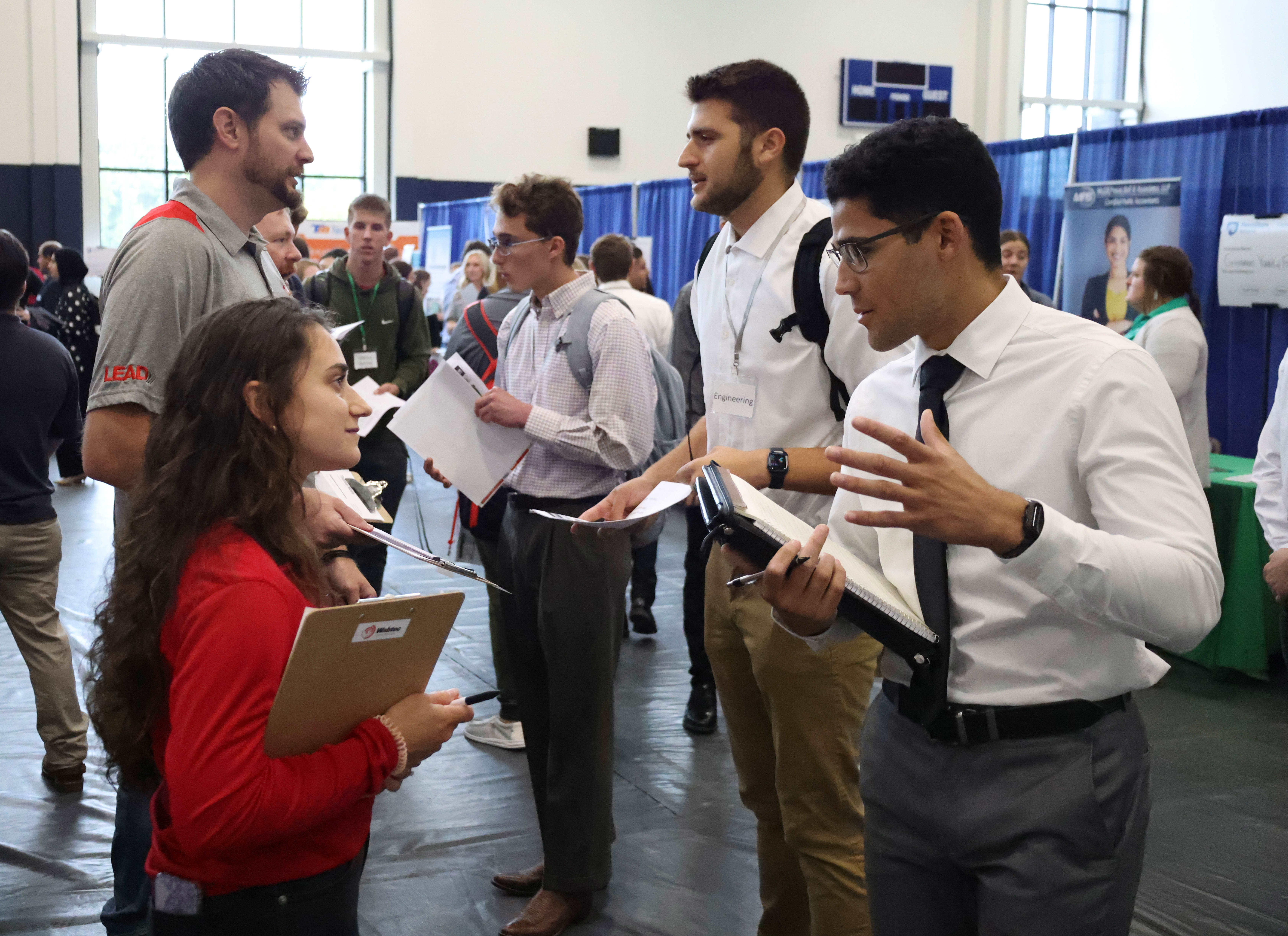 Students talk with recruiters at a Penn State Behrend career fair.