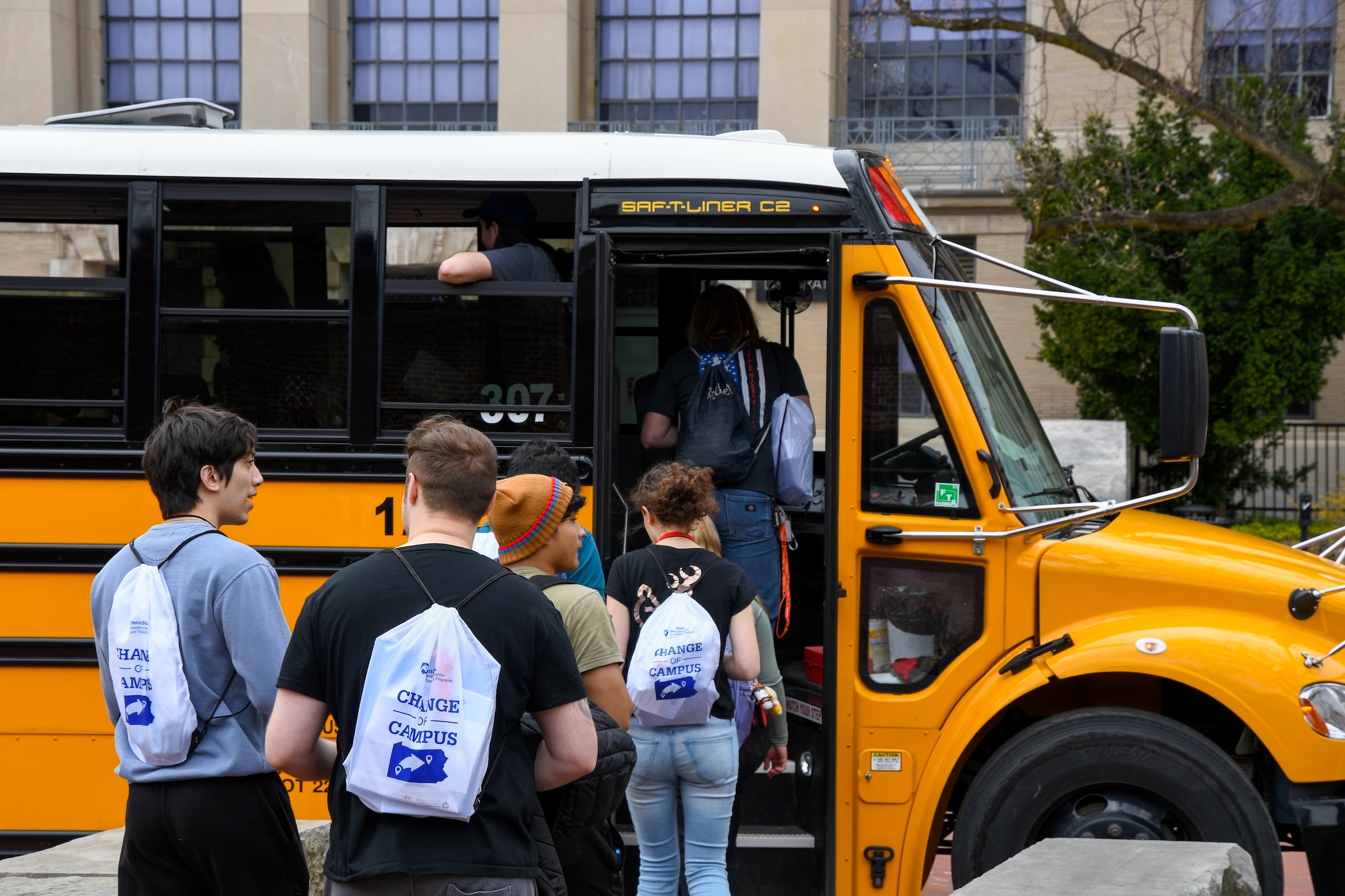 Students waiting in line to enter school bus
