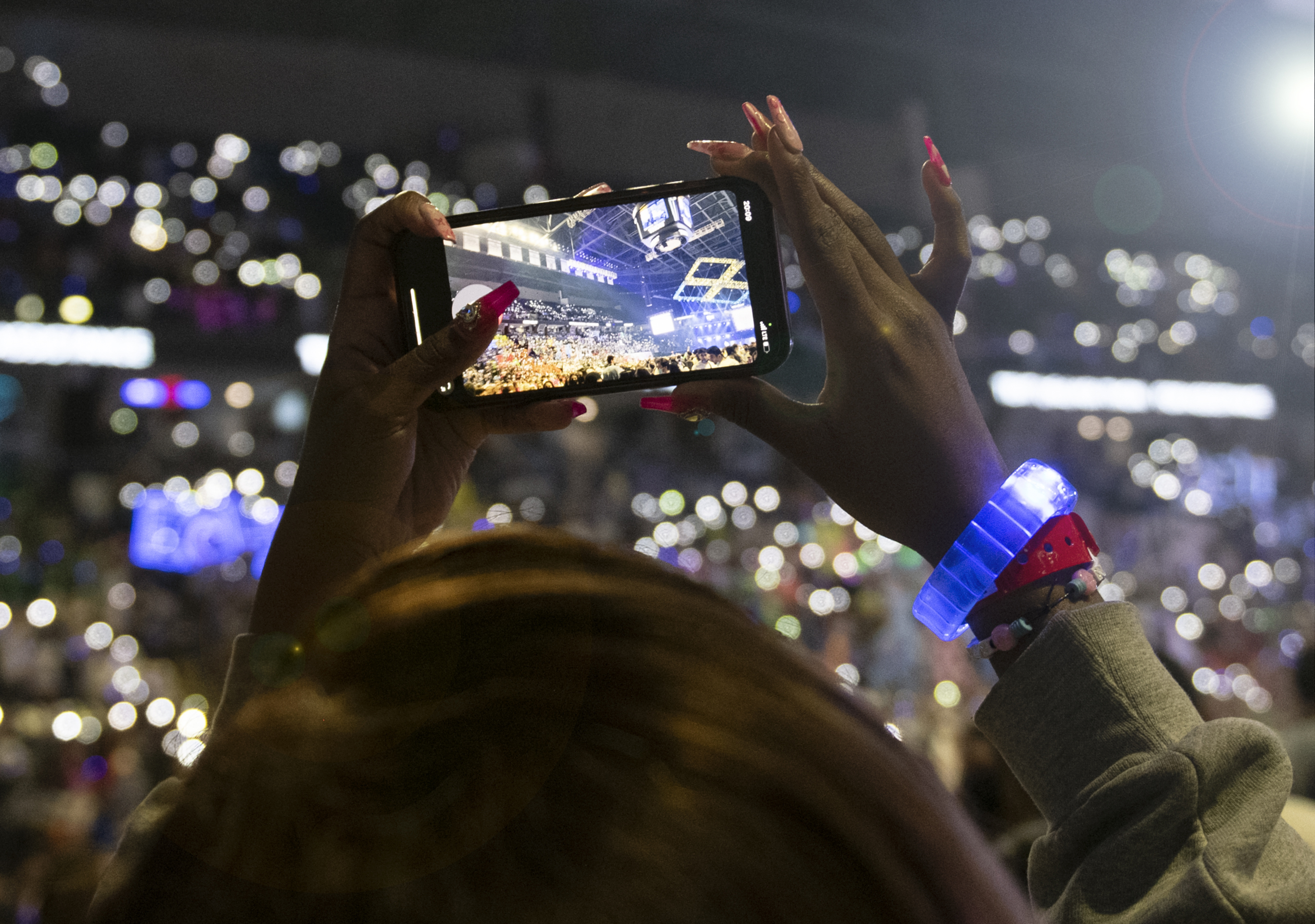 A spectator uses as smartphone to take a picture of the ceiling at THON