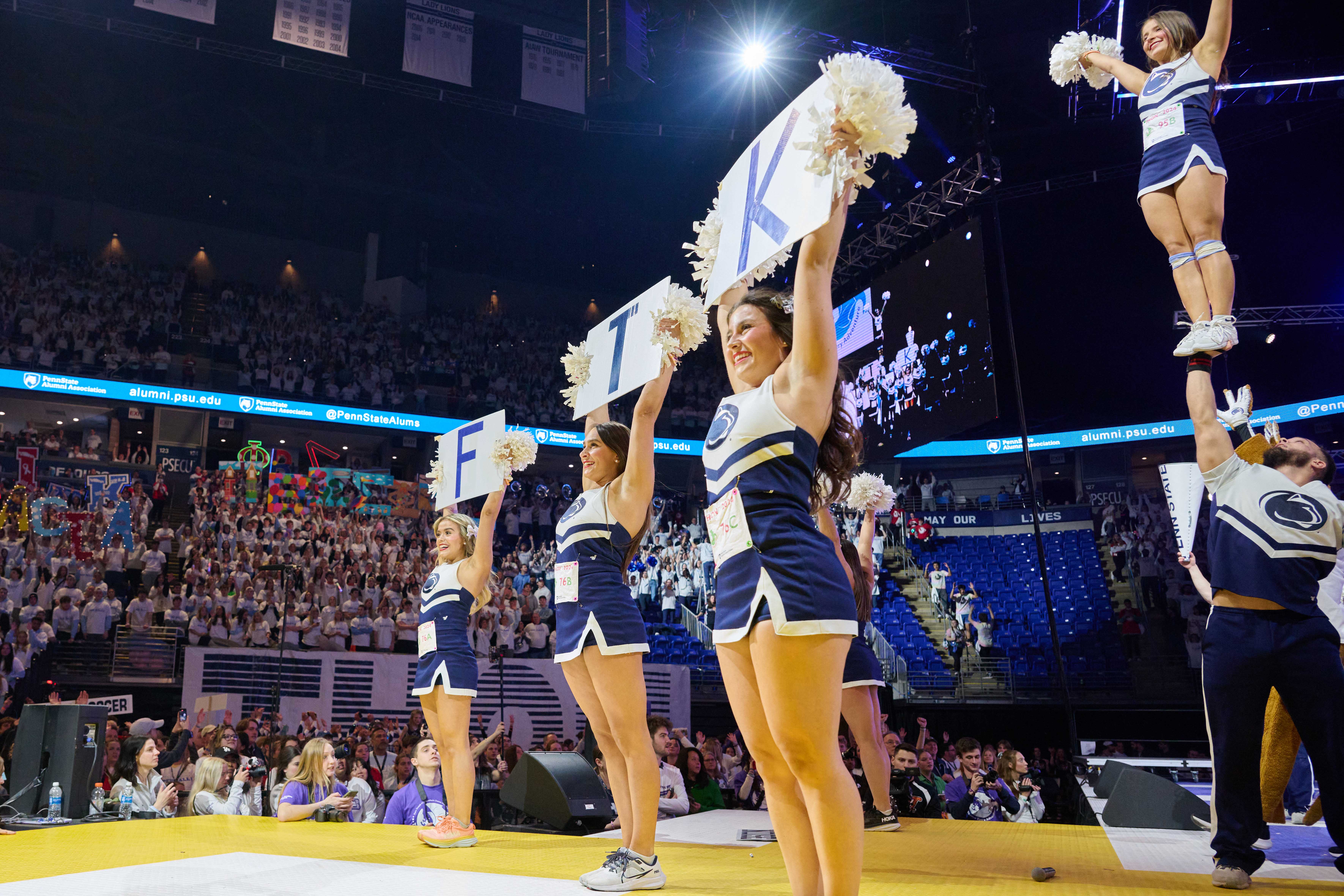 Penn State Cheerleaders performing on stage during THON