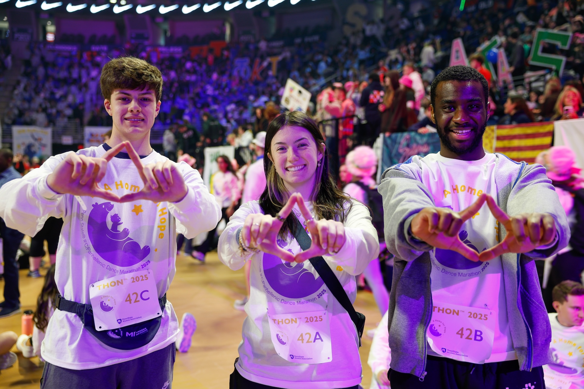 people standing with hands in diamond shape
