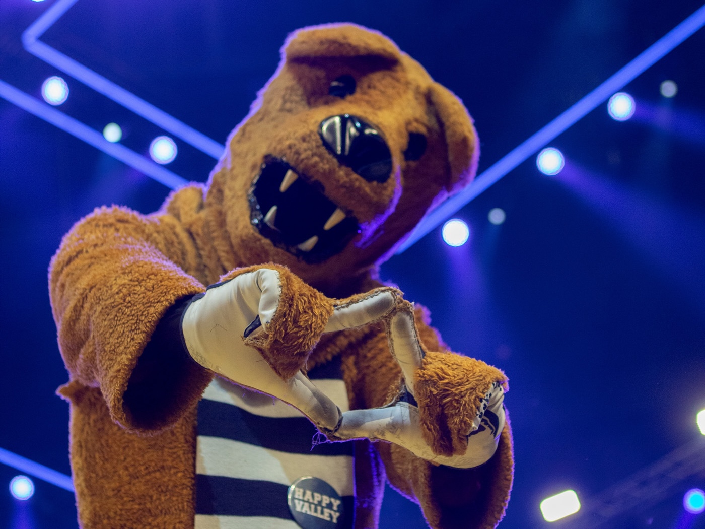 Nittany Lion at THON making the Four Diamonds sign