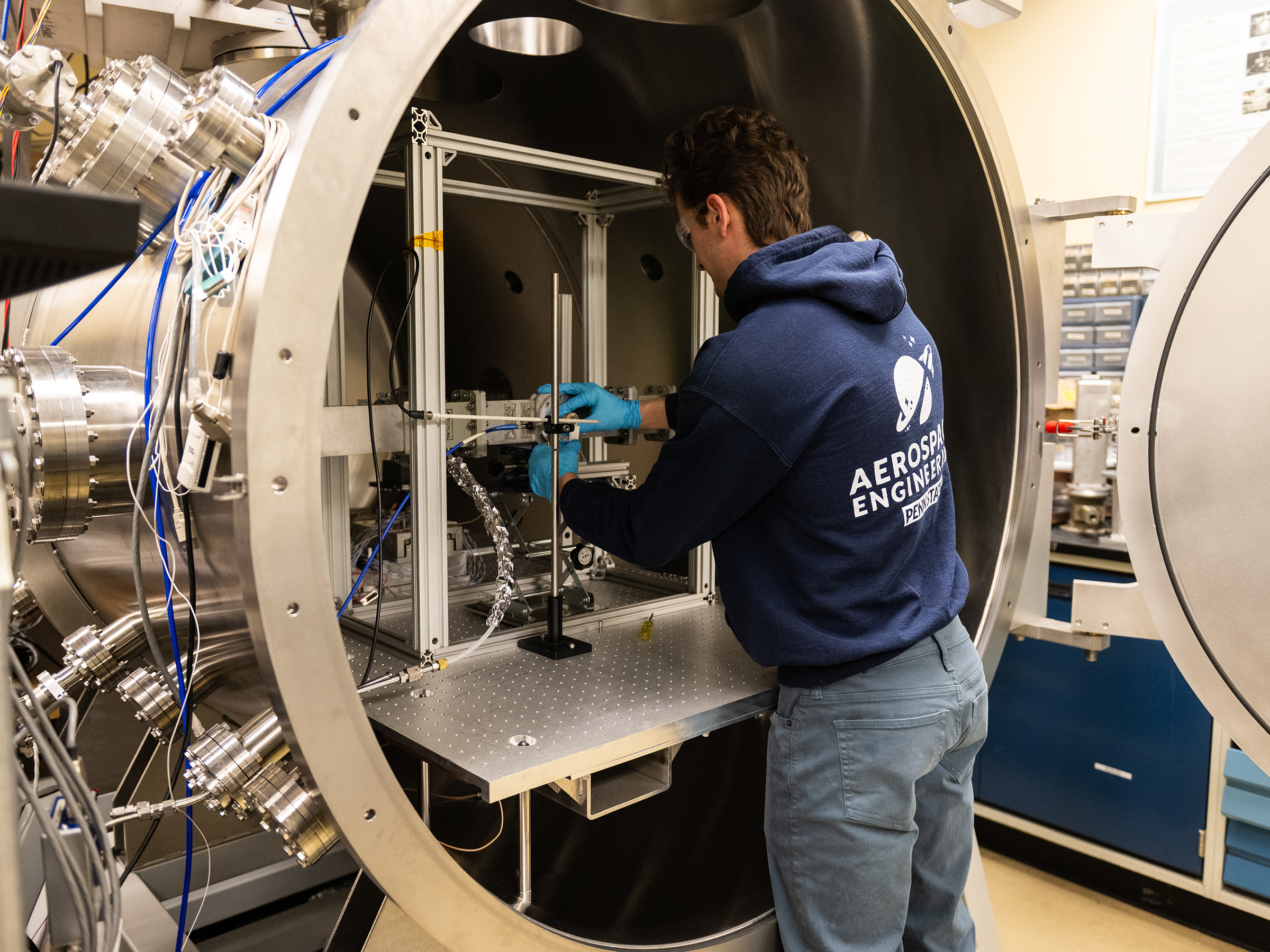 Person in front of a vacuum chamber