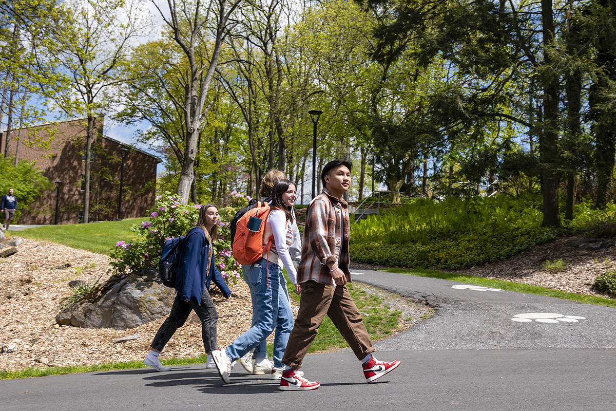 Students walking on campus on a sunny day