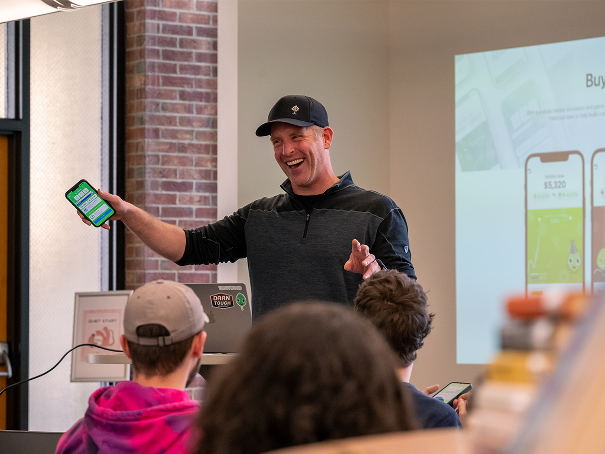 Gene Natali gives an animated presentation to students inside the Blissell Library.