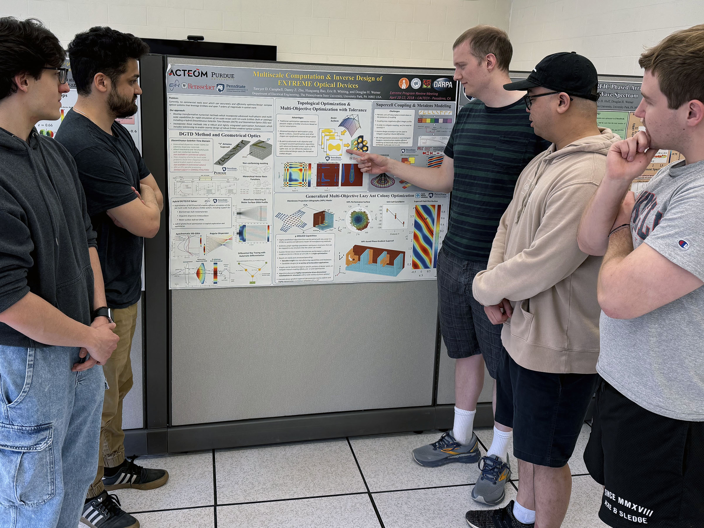 students viewing a poster presentation