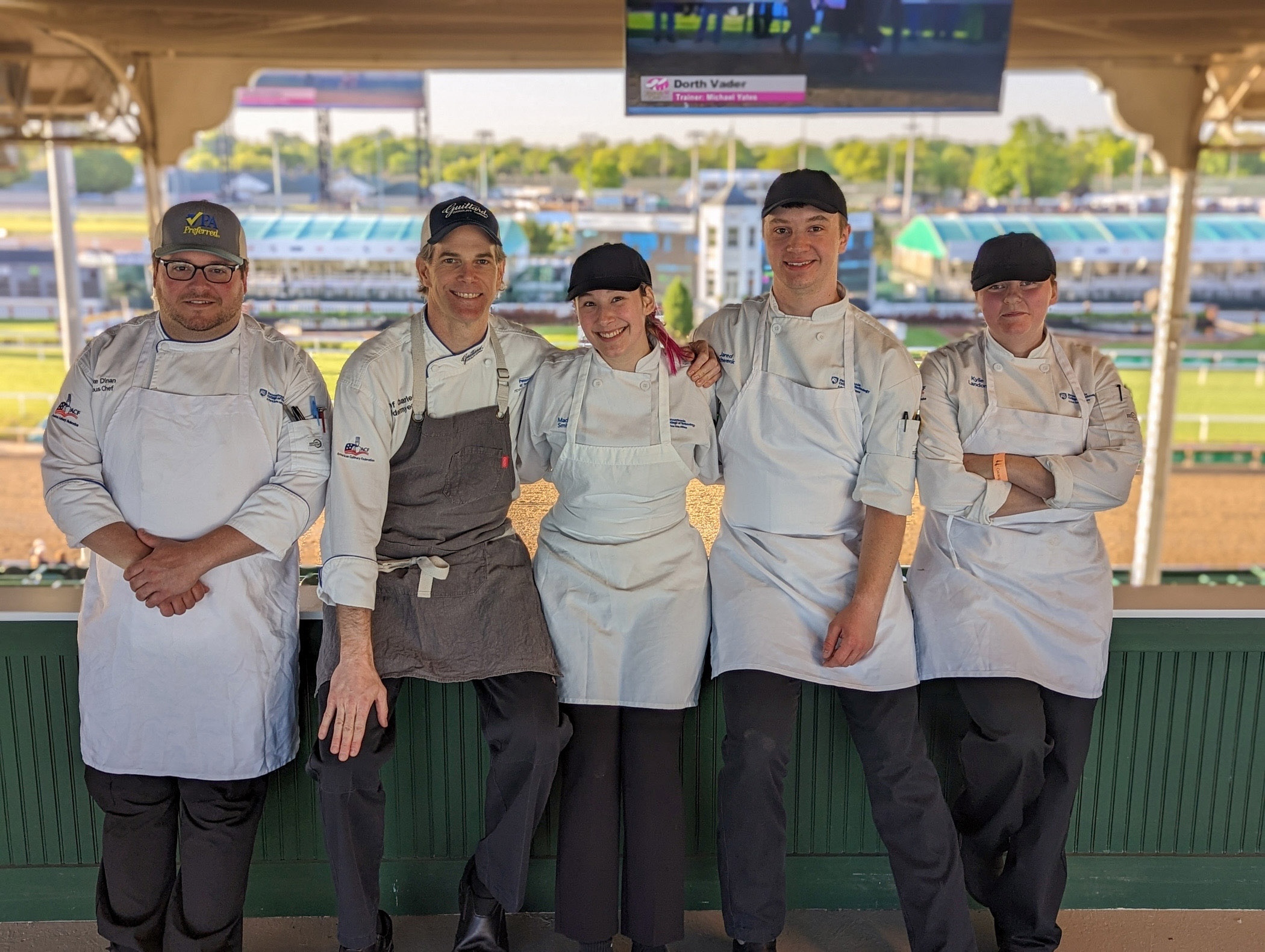 Pennsylvania College of Technology employees and students pause for a photo at Churchill Downs race track.