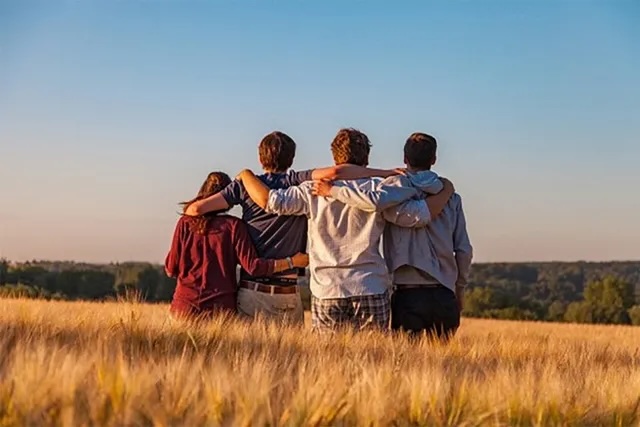 a group of folks looking at the sun