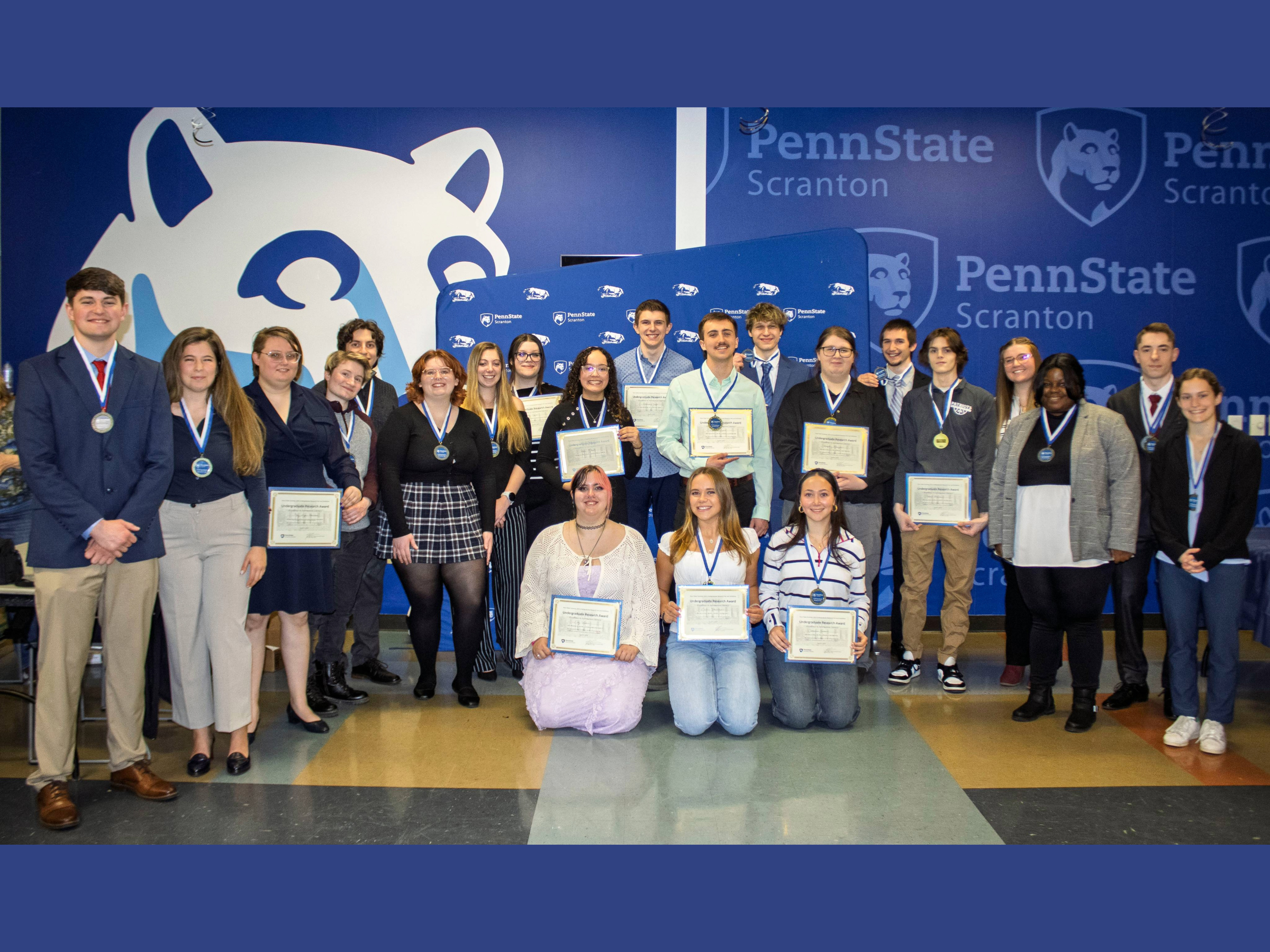 winners in scranton's research fair pose with their certificates and medals