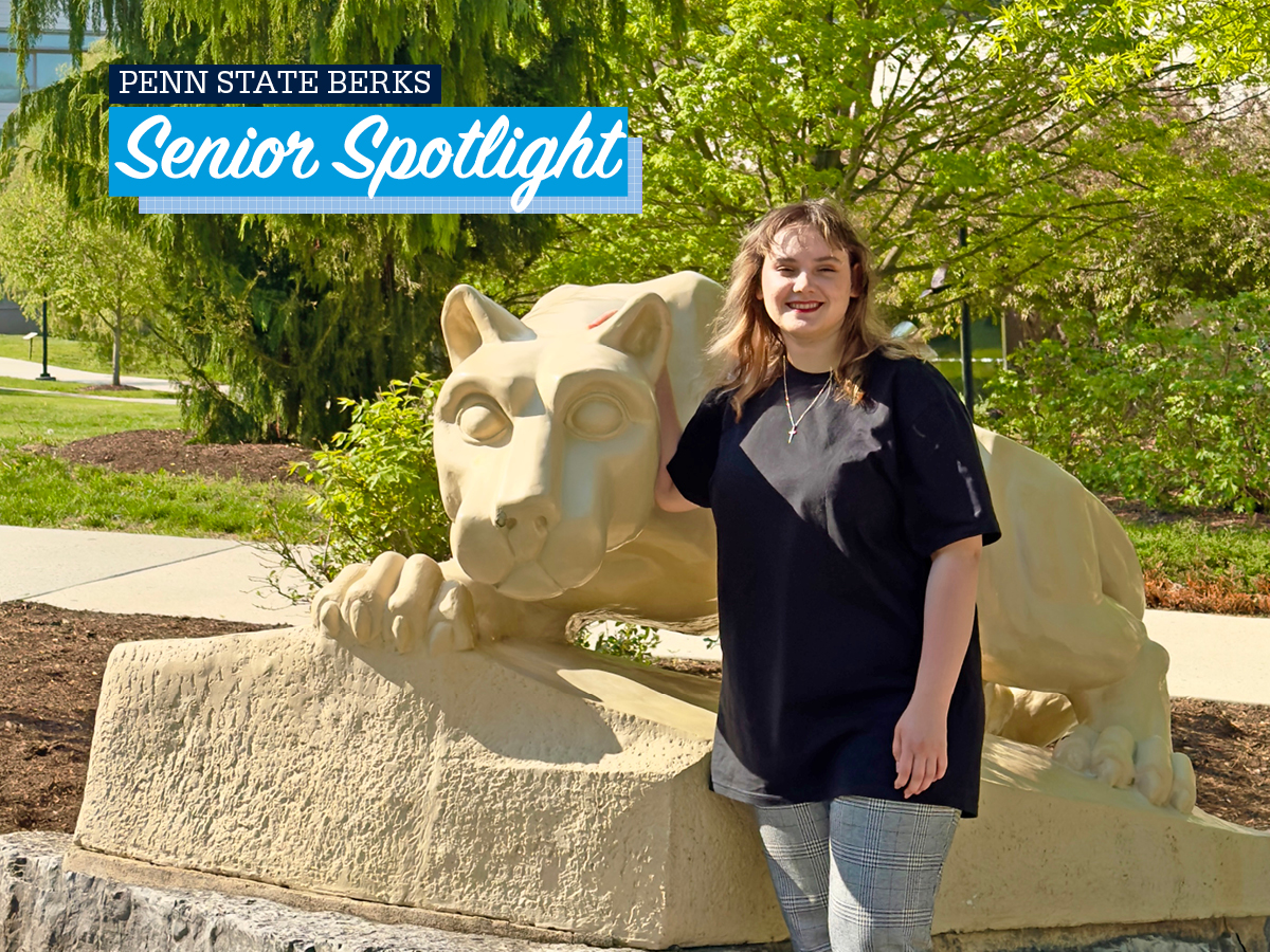 Viktoriia Vozharenko standing by Lion Shrine