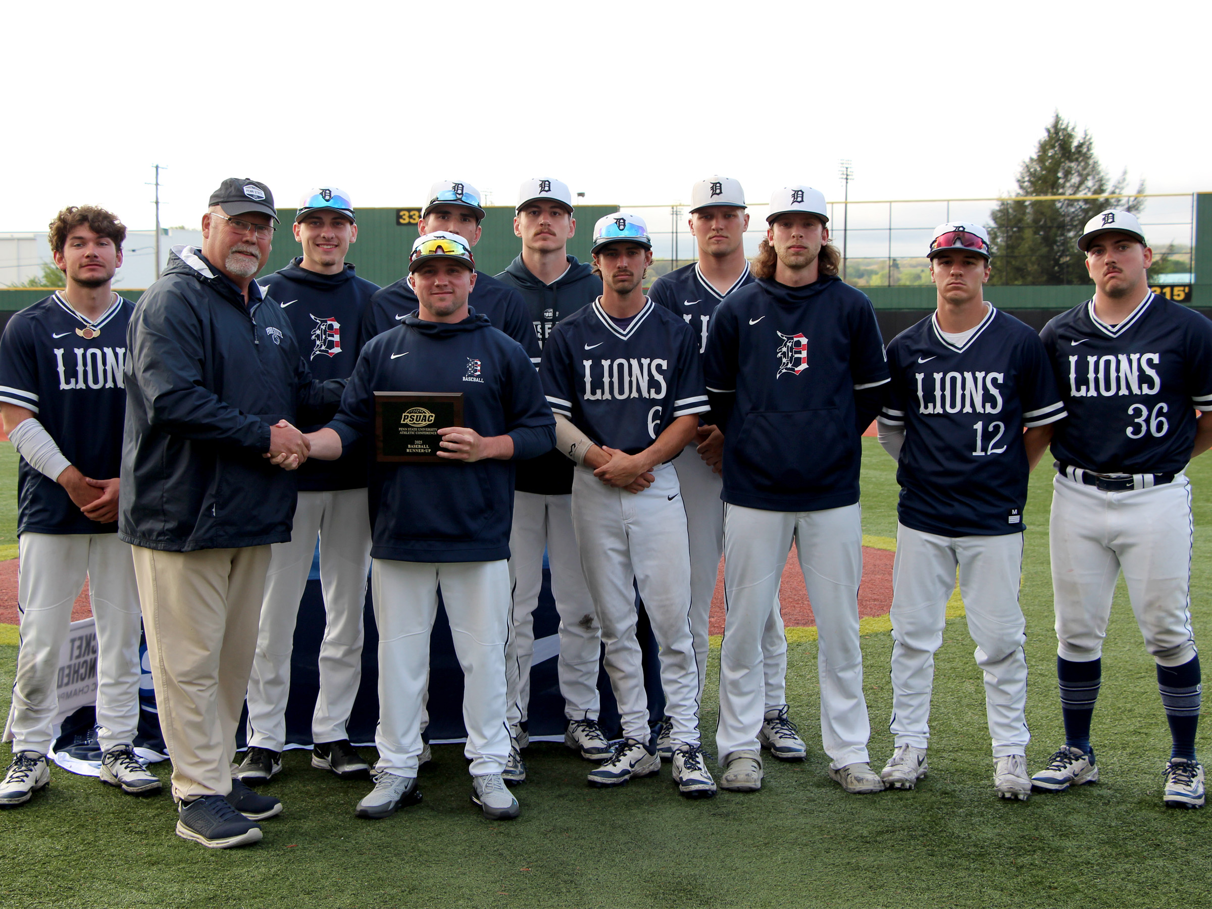 Members of the Penn State DuBois baseball team accept the runner up plaque for the 2025 PSUAC baseball season following the championship series at Showers Field in DuBois.
