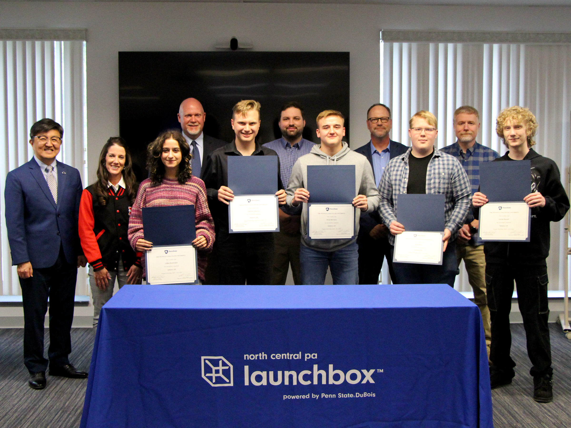 Students from the inaugural cohort of the Industry 4.0 Academy display their program certificates received during the certificate presentation ceremony held at Penn State DuBois. Students were joined by faculty and staff members from Penn State DuBois, the NCPA LaunchBox and the DuBois Area School District. 