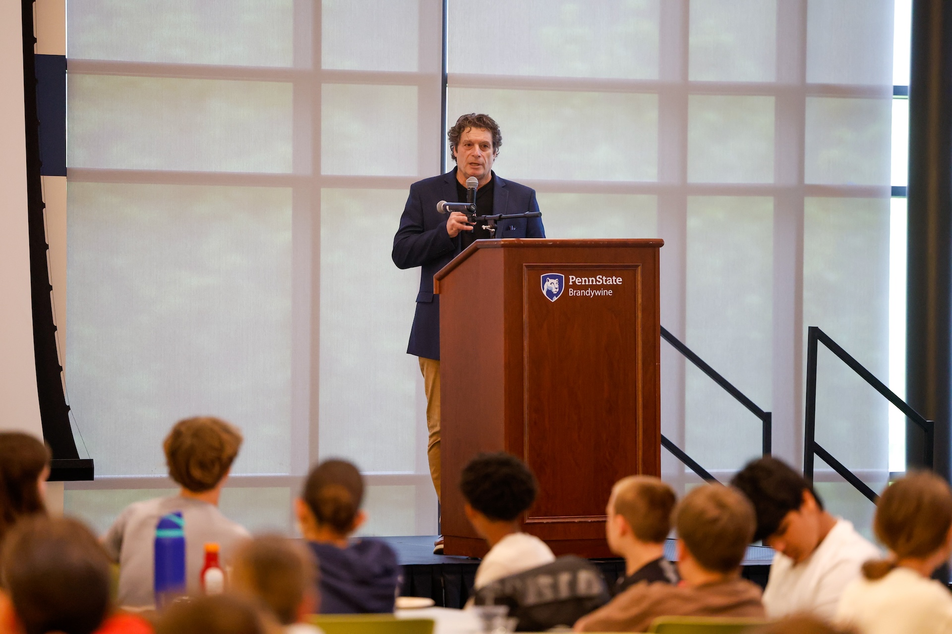 tony mattei speaking on stage