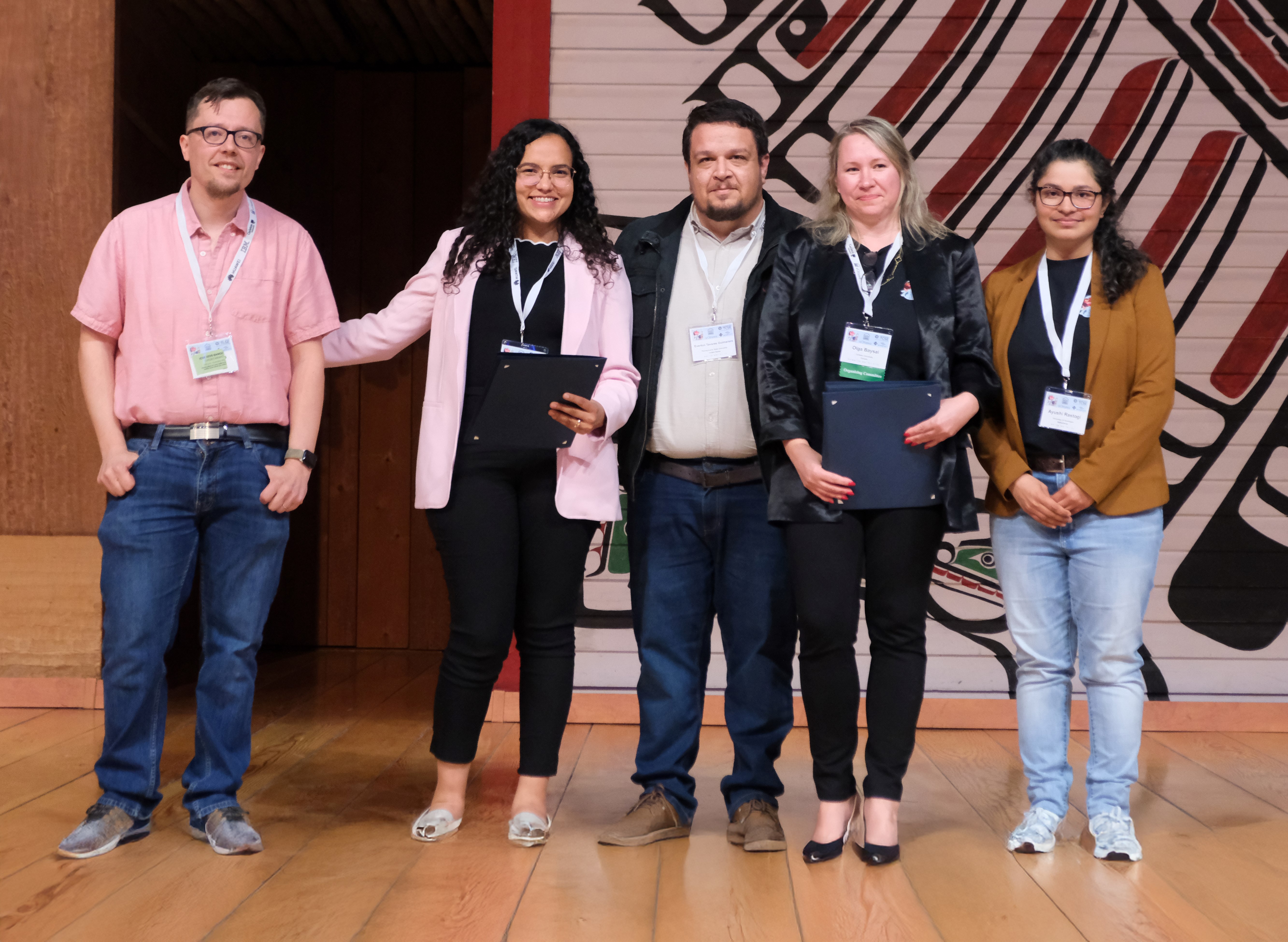 Five people receive awards for their research at an academic conference