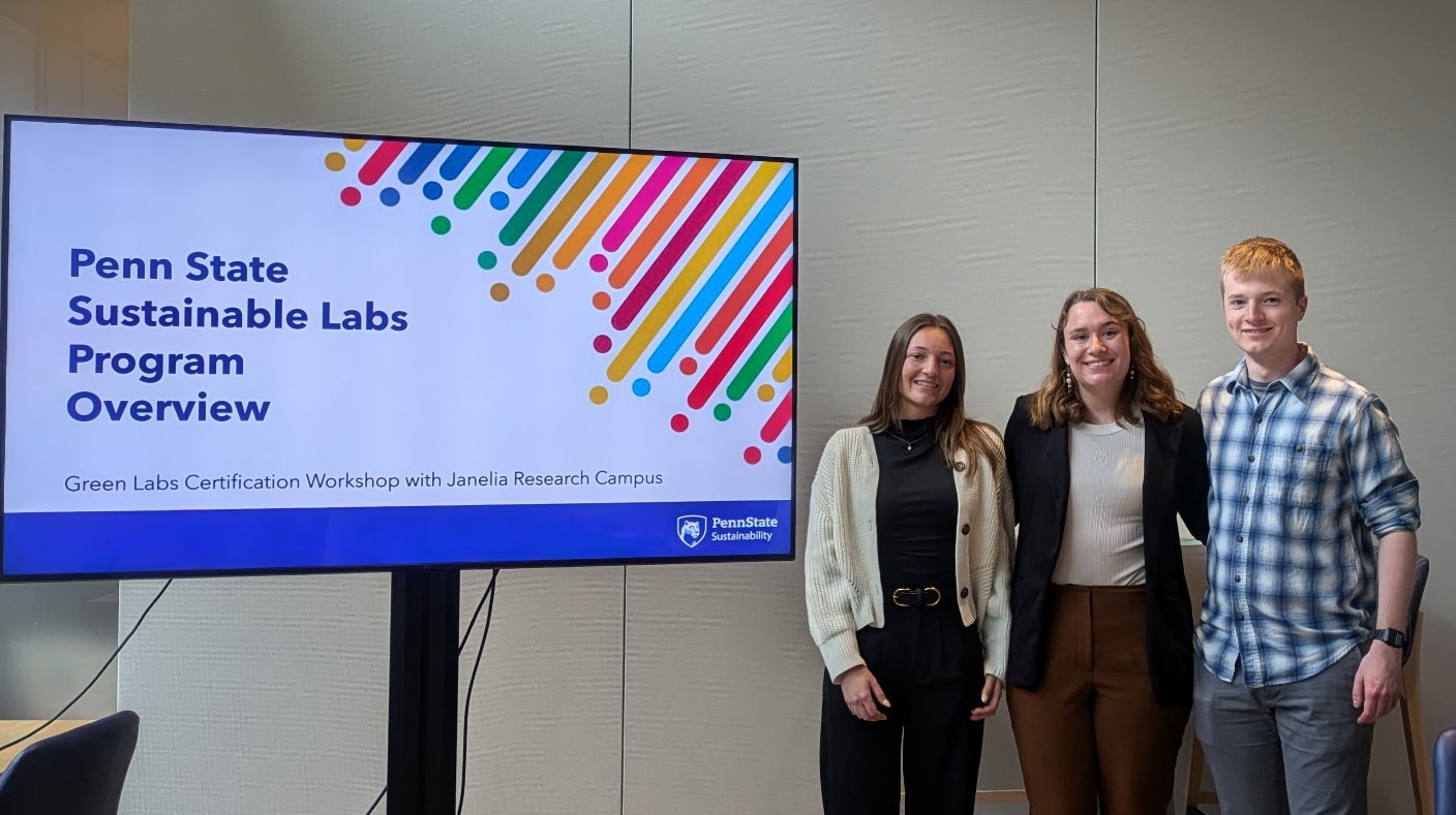 Three students present slides at a research center