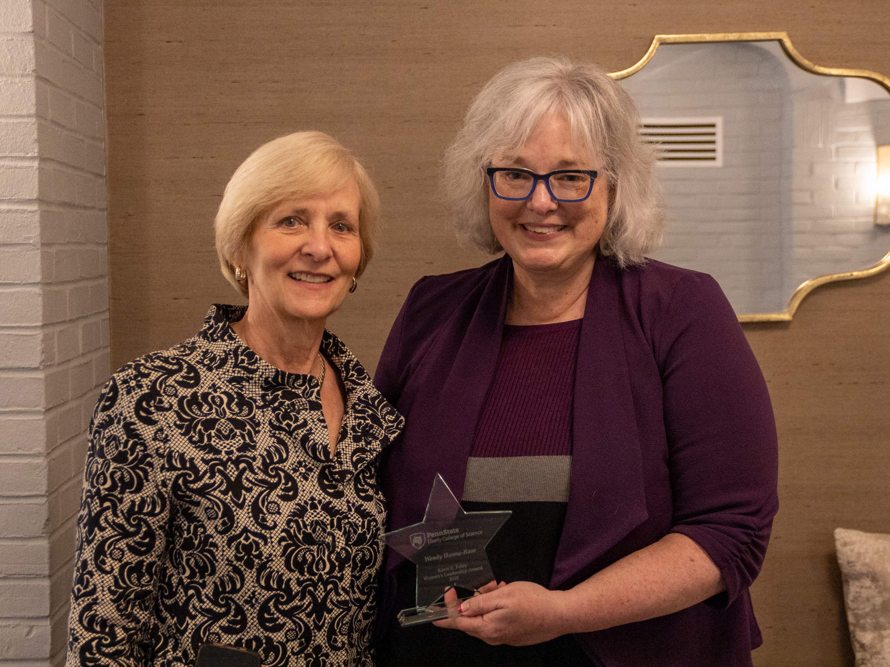 Karin Foley and Wendy Hanna-Rose posing with an award