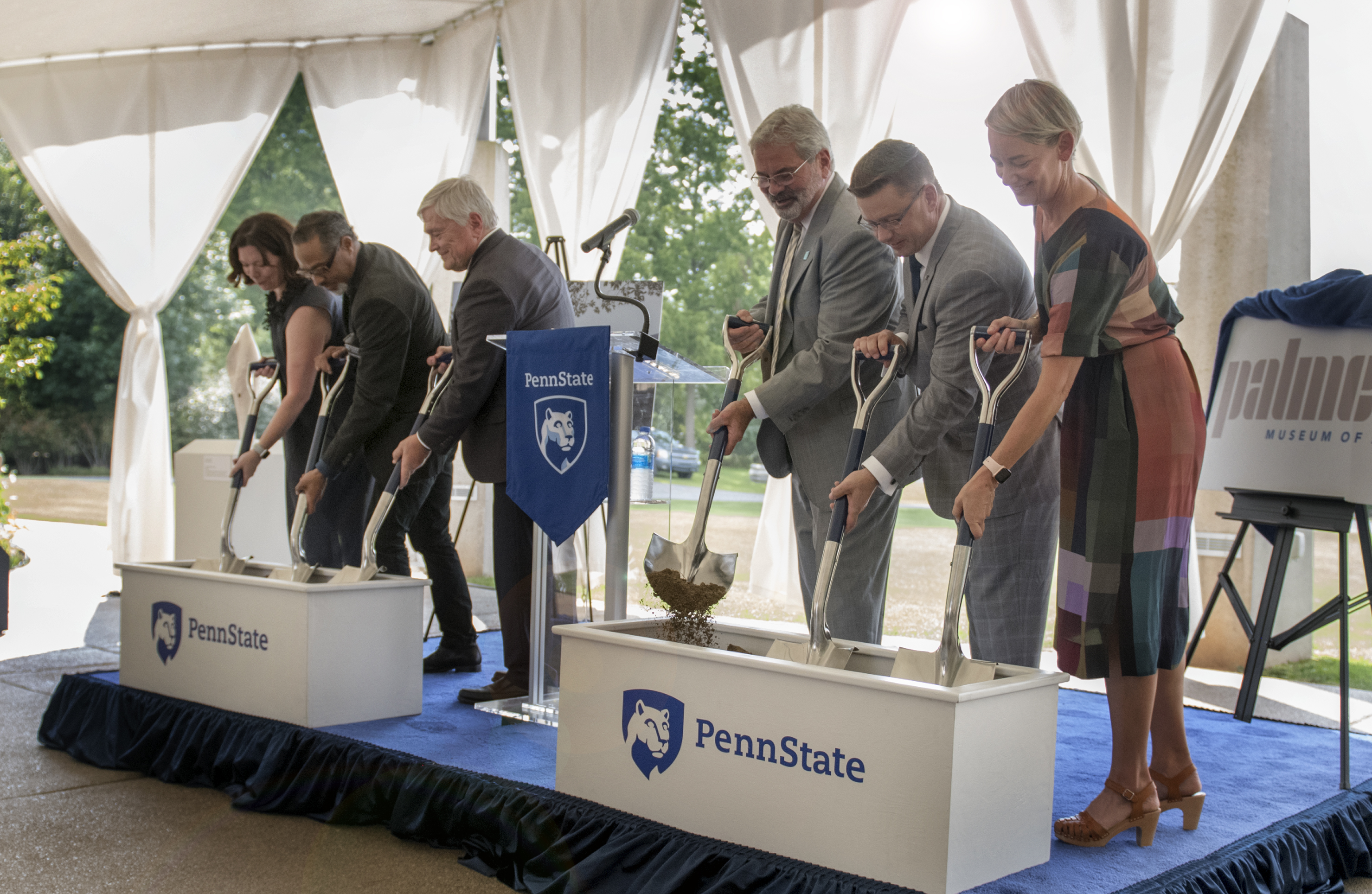 Six people participate in ceremonial groundbreaking for Palmer Museum of Art.