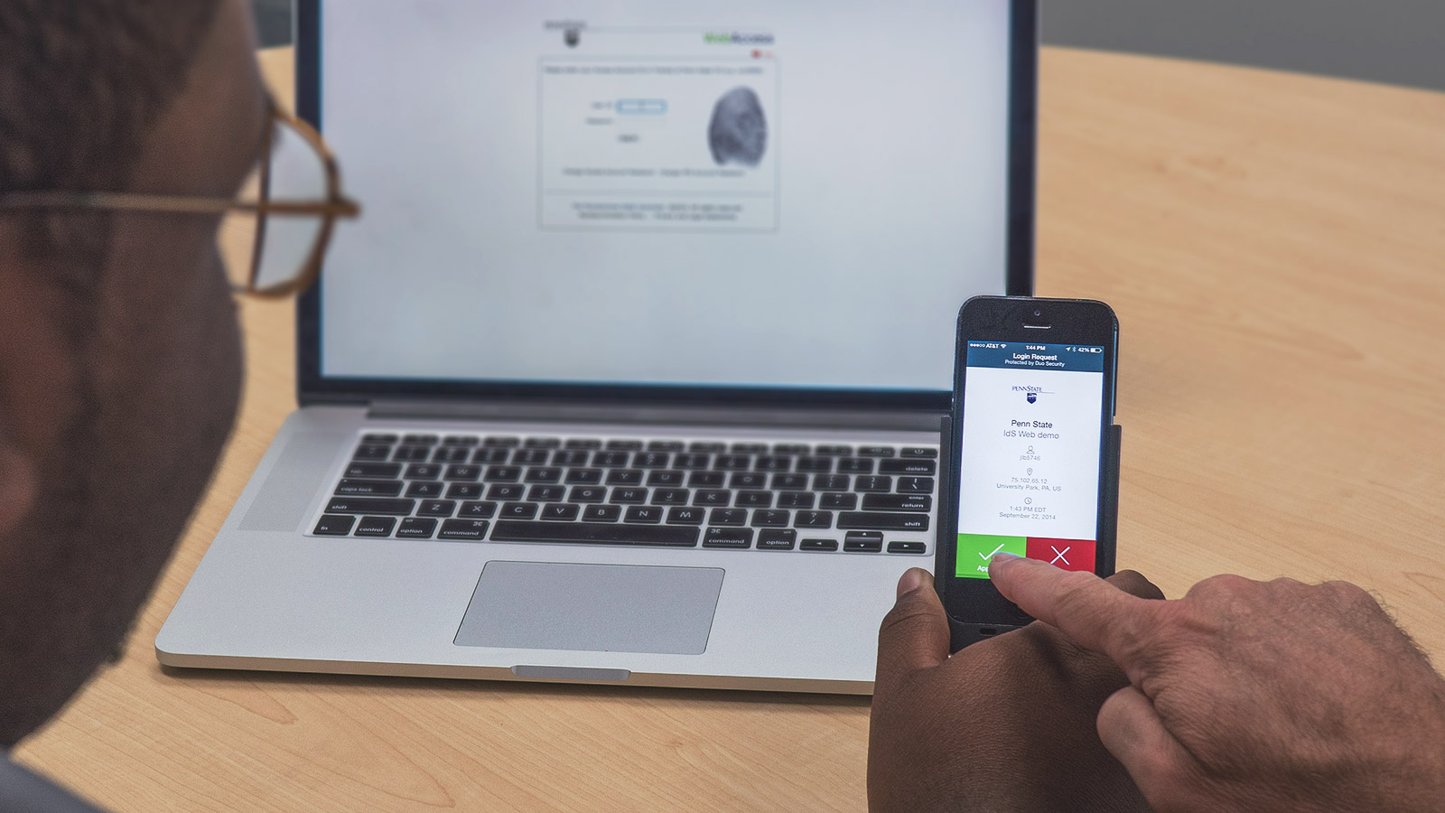 Penn State employee using two-factor authentication on a smartphone