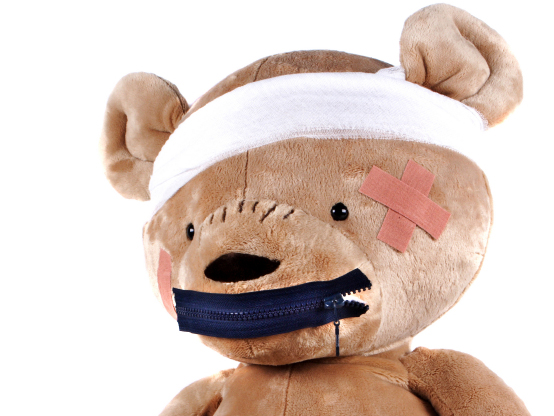 teddy bear with bandaged head, zipper on mouth