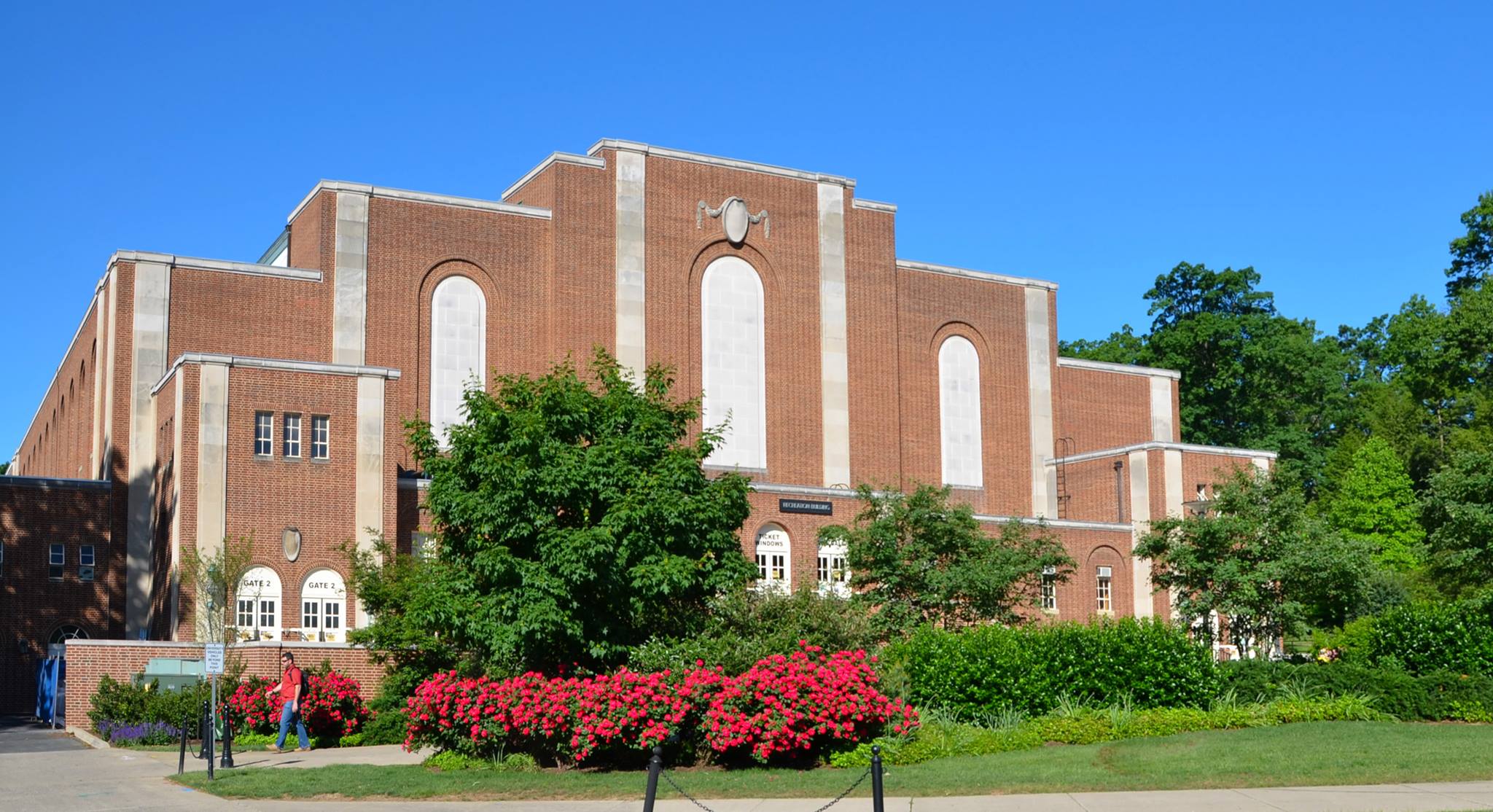 Front exterior of Rec Hall with flowers in summer