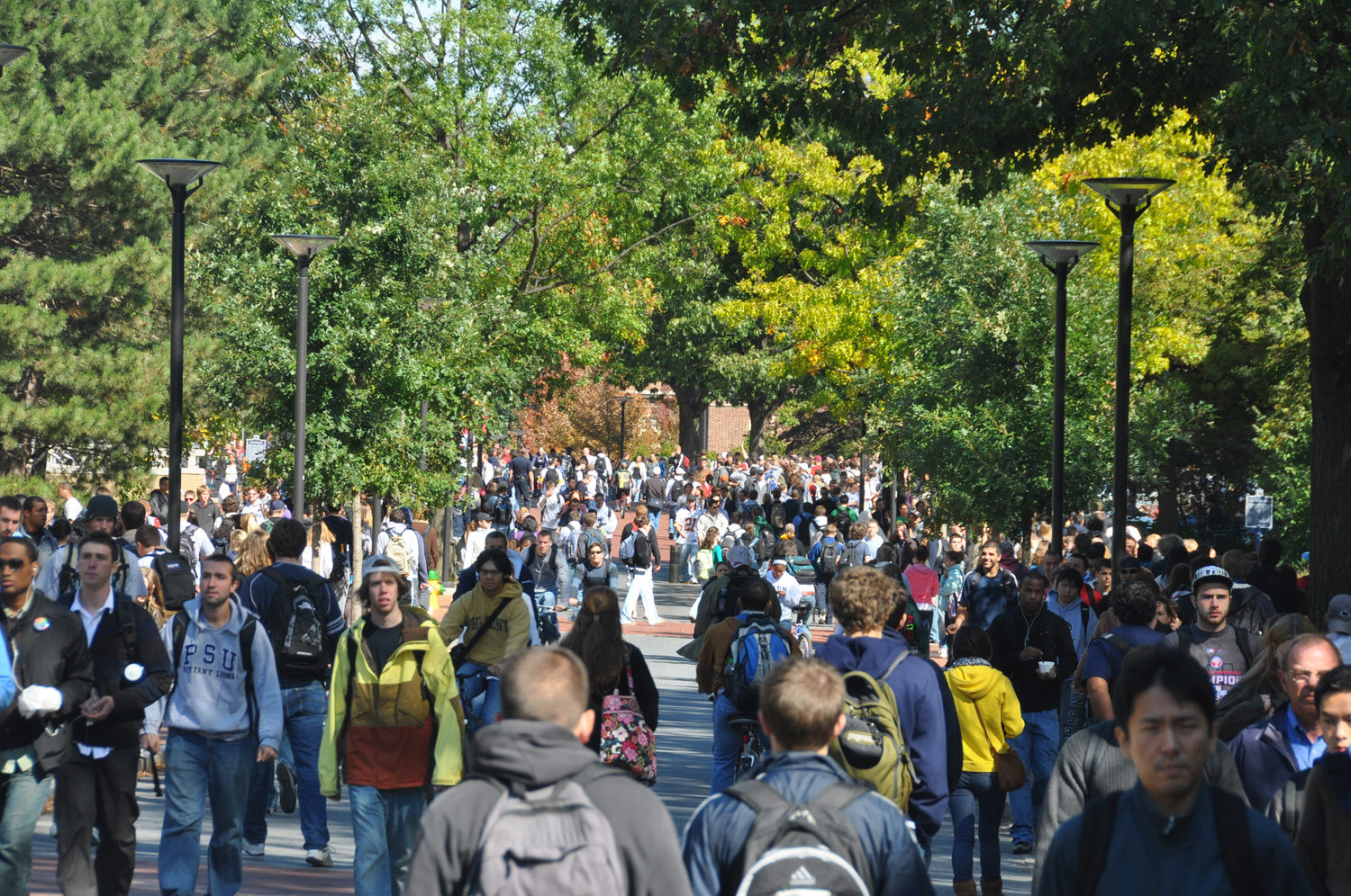 Students outside of Old Main along Pollock Road at University Park. 