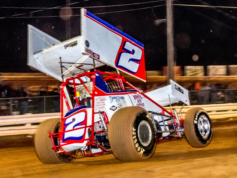 Close up of a race car on a dirt race track