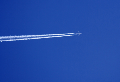 vapor trail against blue sky