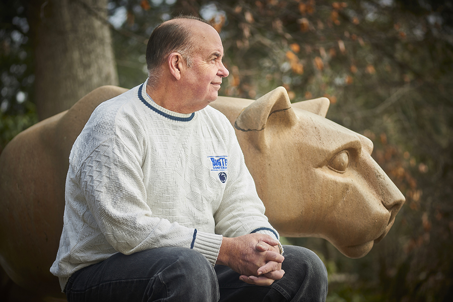 Andrew Moore sits in front of the Lion Shrine.