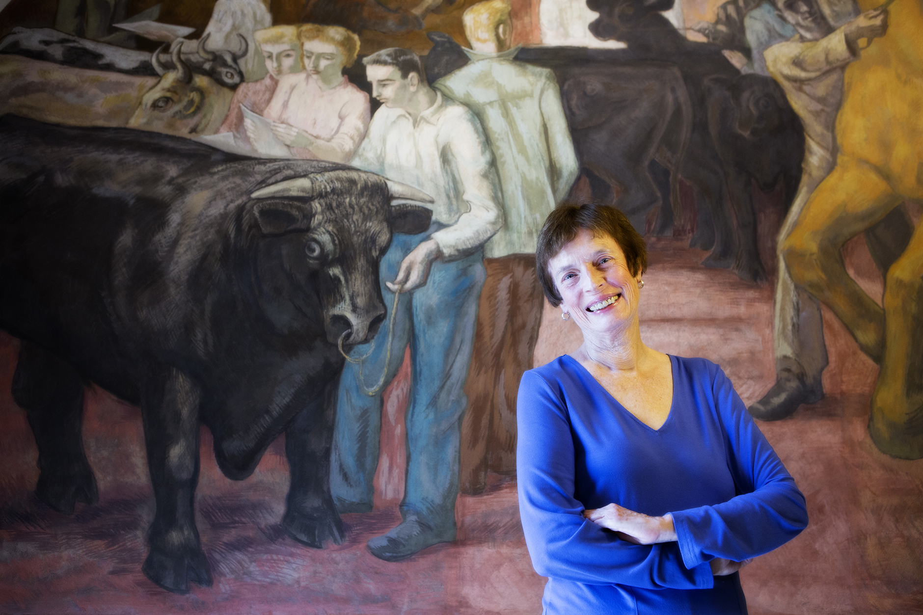 Anne Riley with Land Grant Frescoes in Old Main