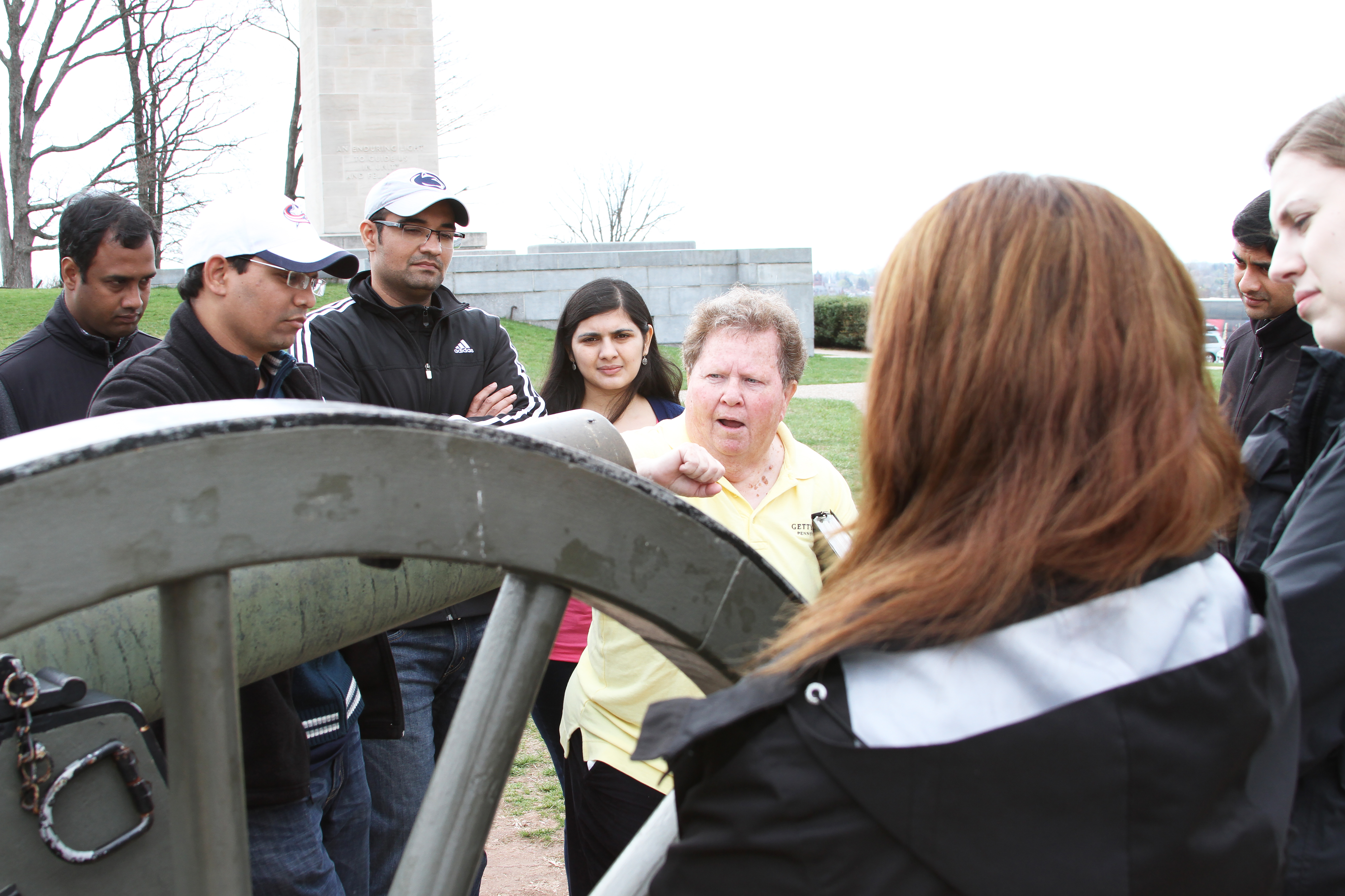 MBA students at a cannon