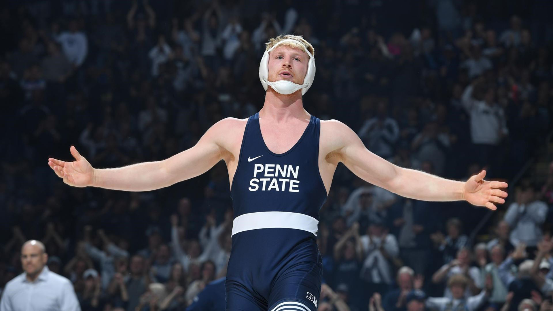 Penn State wrestler Bo Nickal with arms outstretched. 