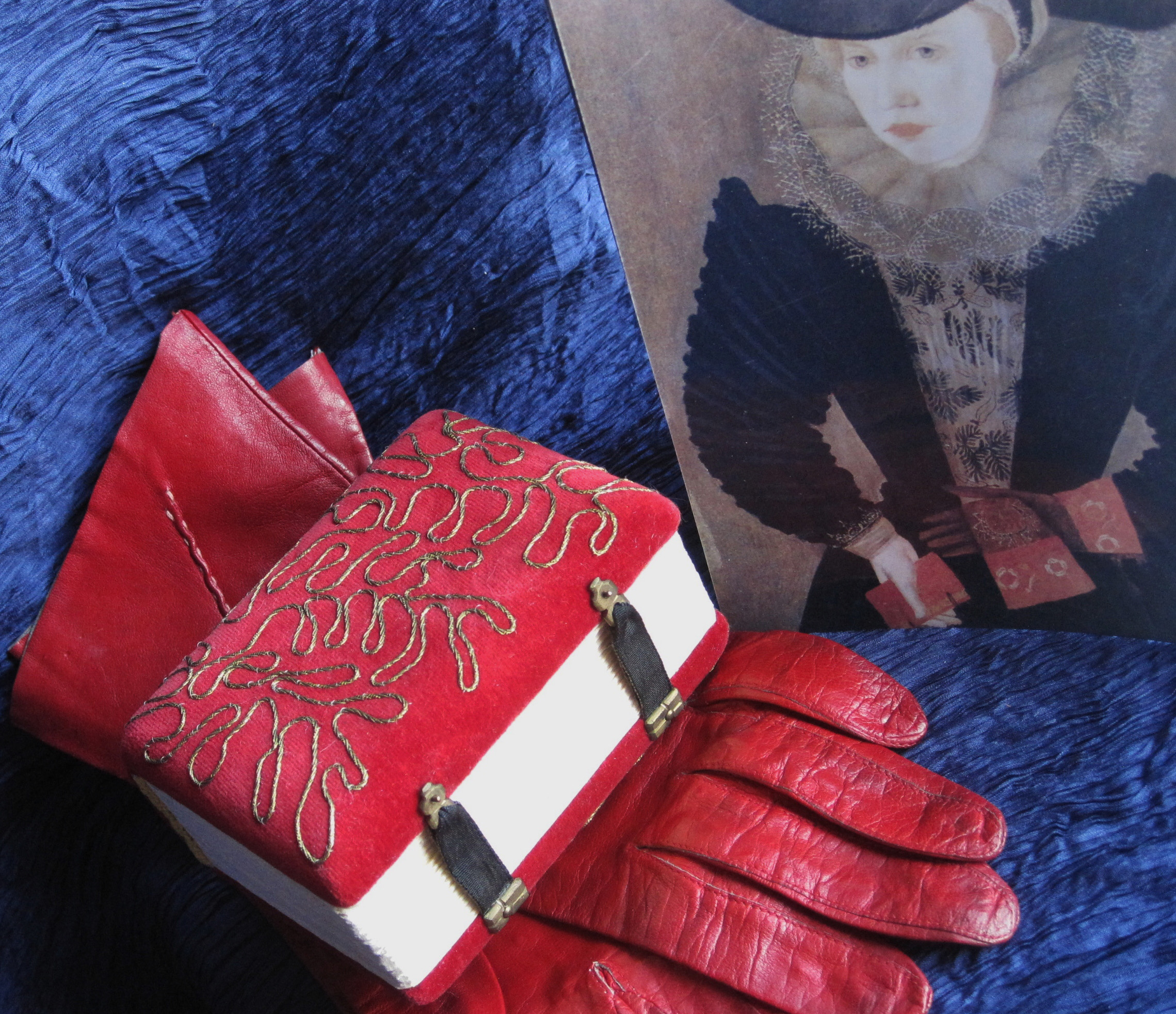 Handmade book from red leather glove.