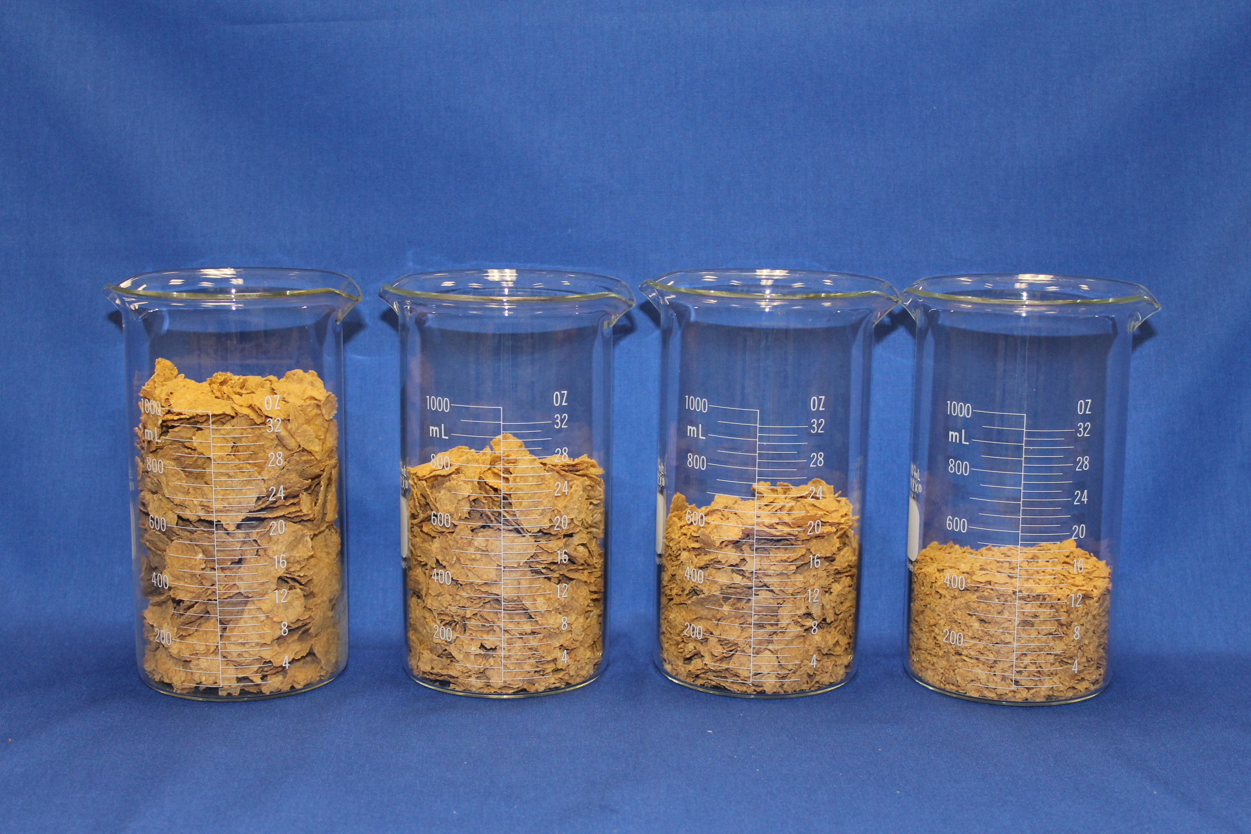 crushed cereal in beakers