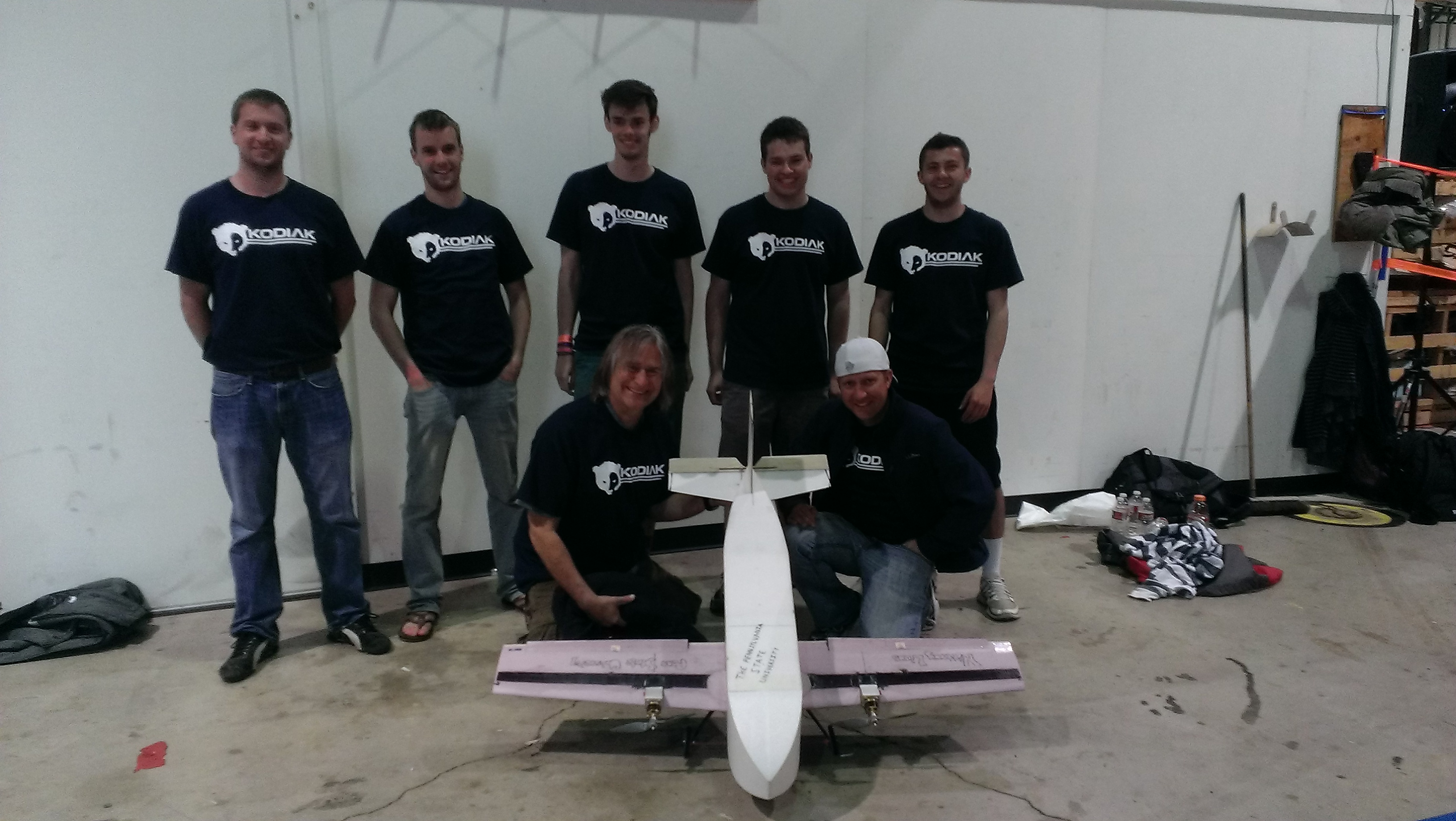 Penn State's AIAA Design/Build/Fly team poses with their craft